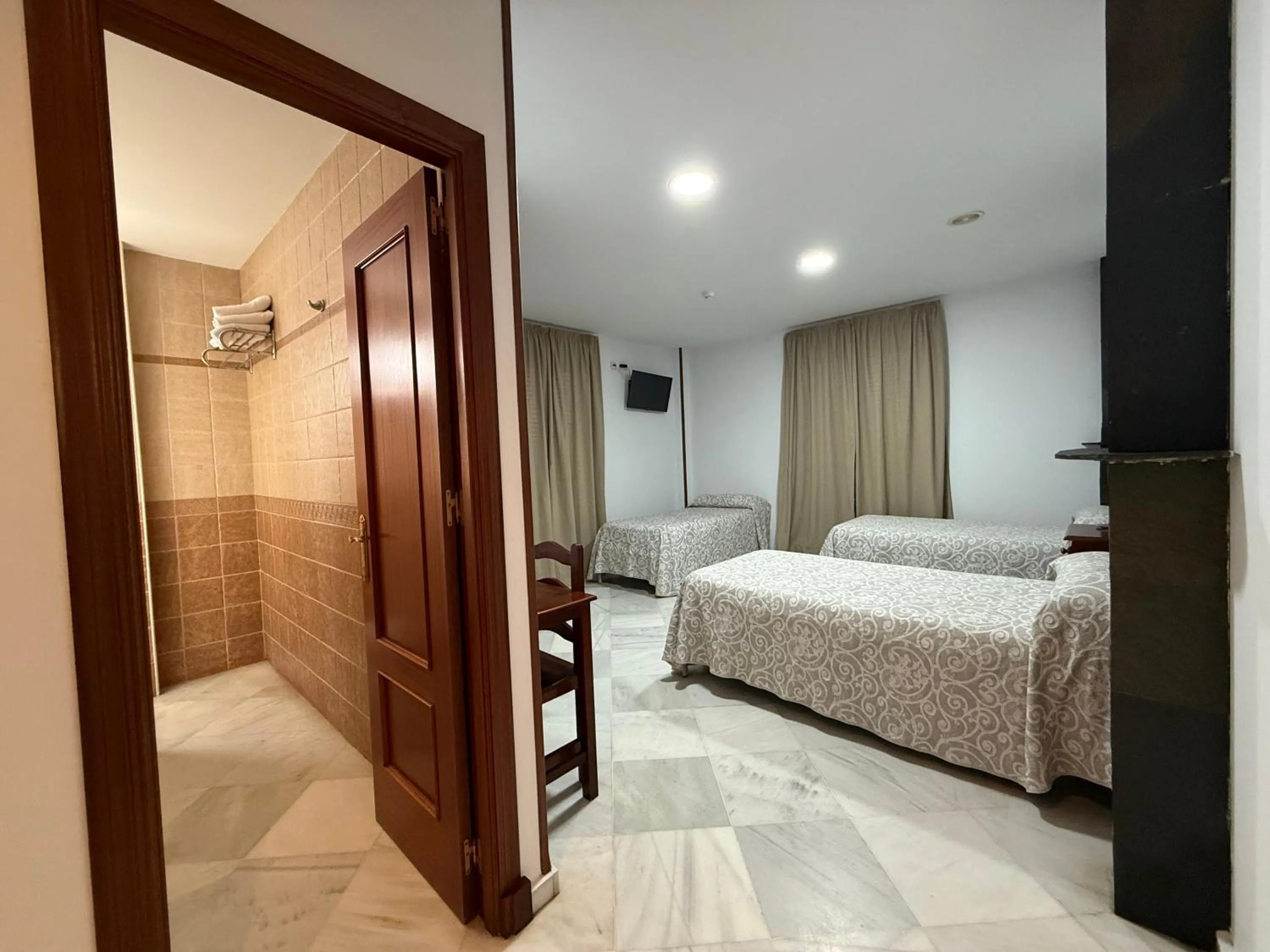 Bed in Hotel Quitagolpe