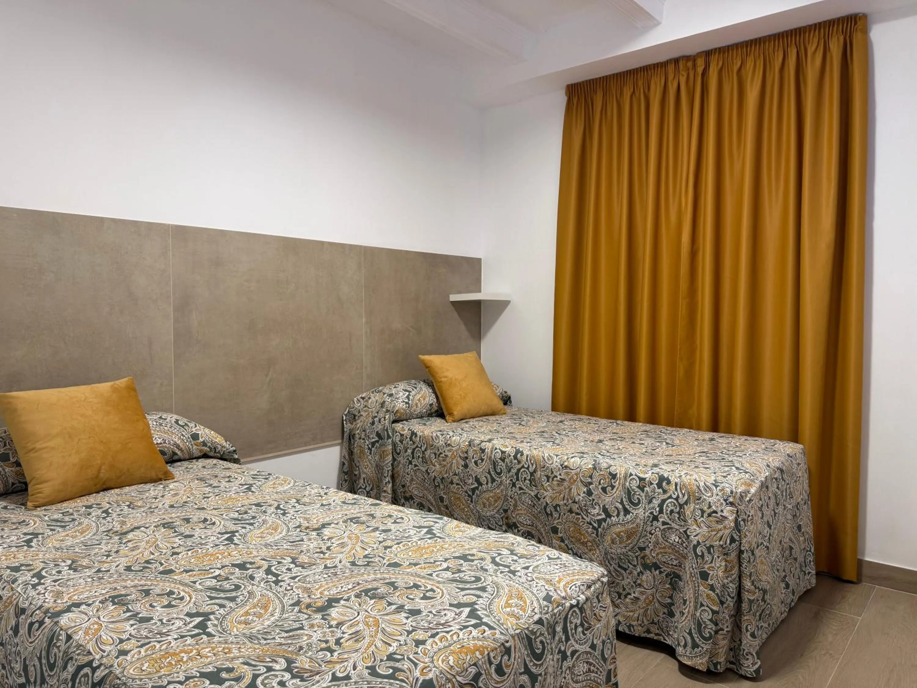 Bed in Hotel Quitagolpe