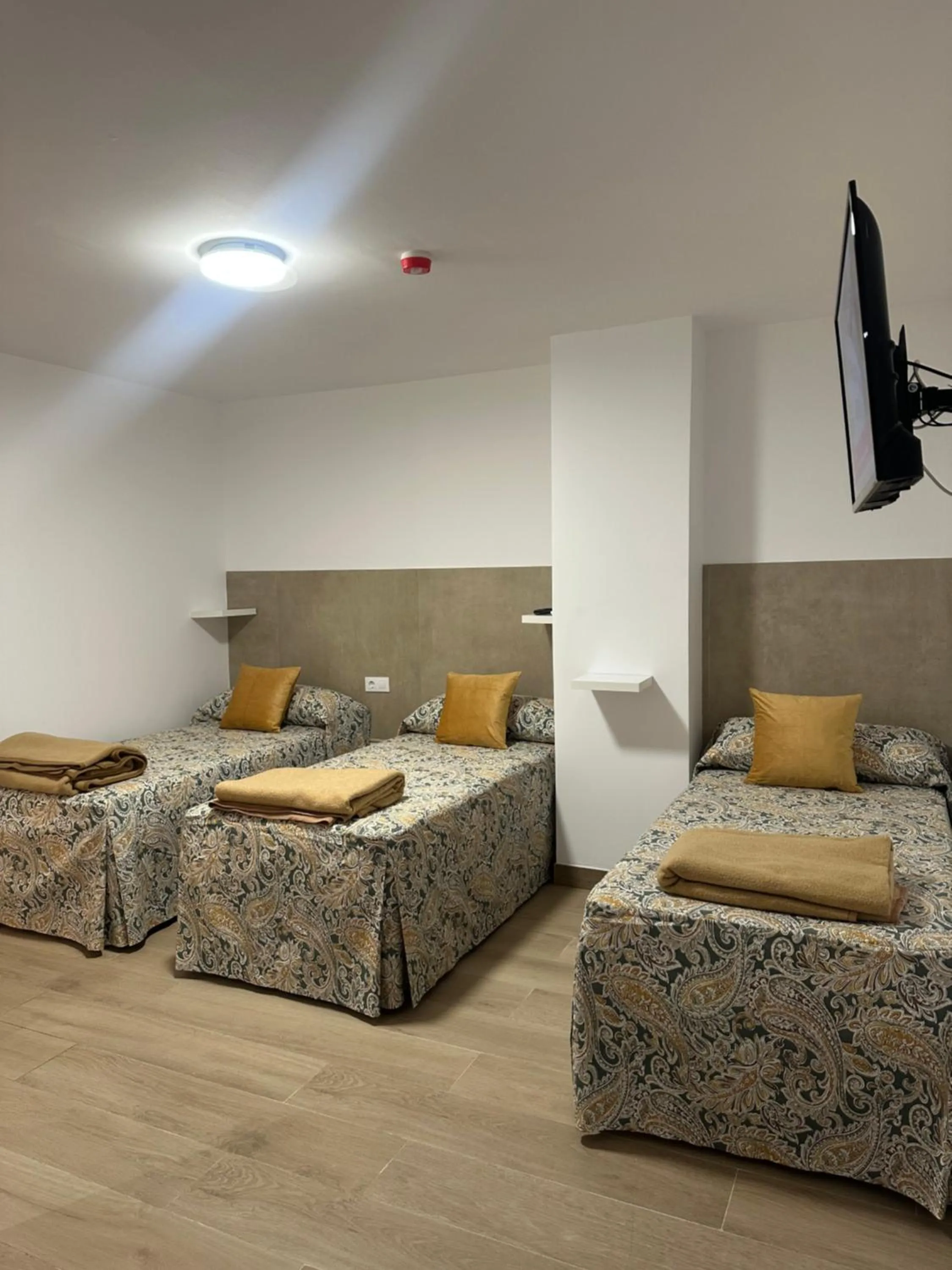 Bed in Hotel Quitagolpe