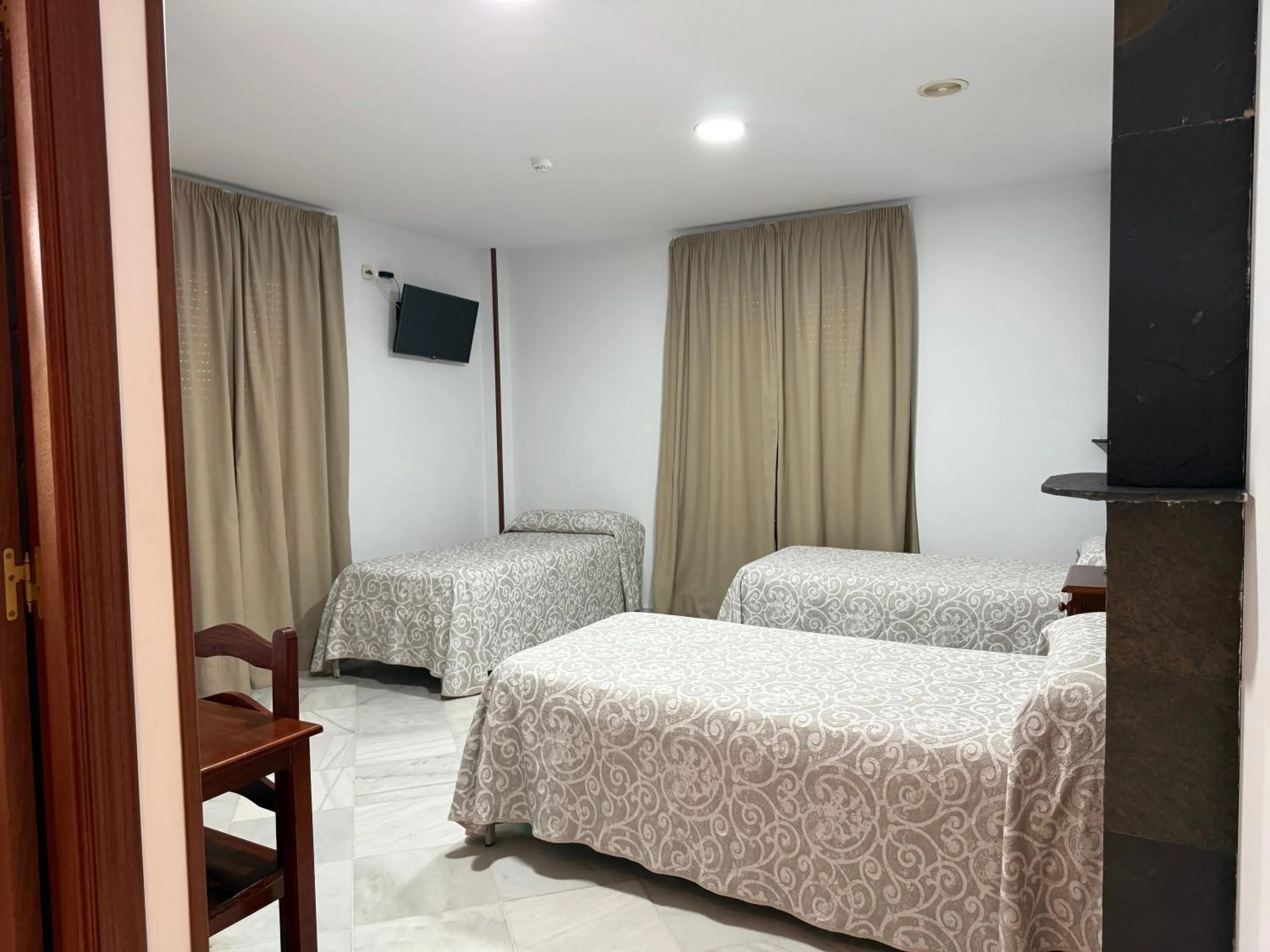 Bed in Hotel Quitagolpe