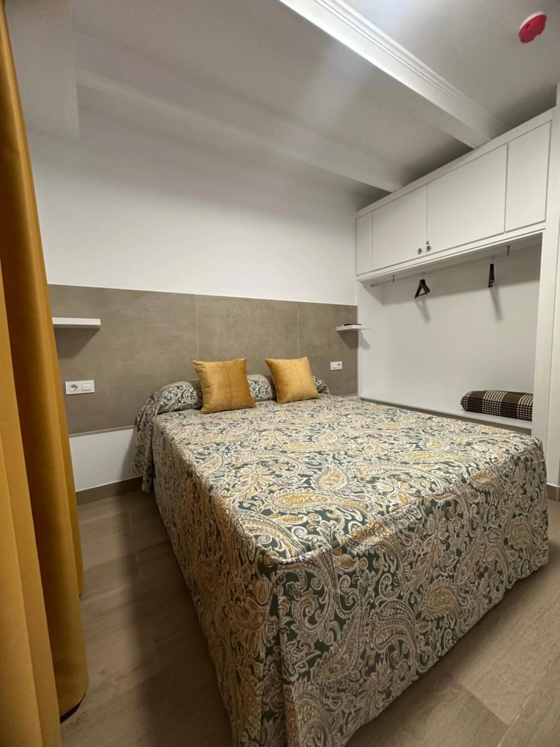 Bed in Hotel Quitagolpe