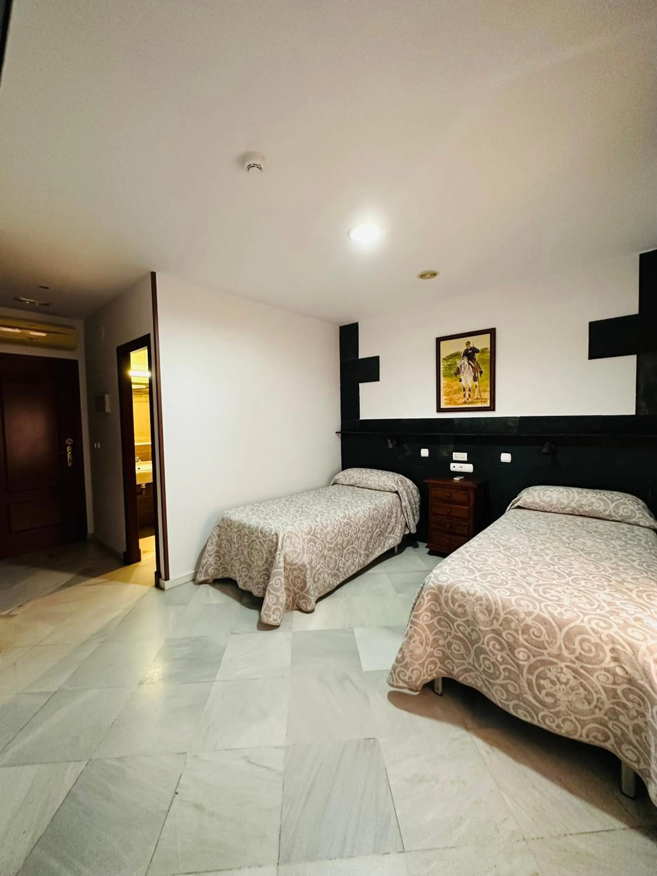 Bed in Hotel Quitagolpe