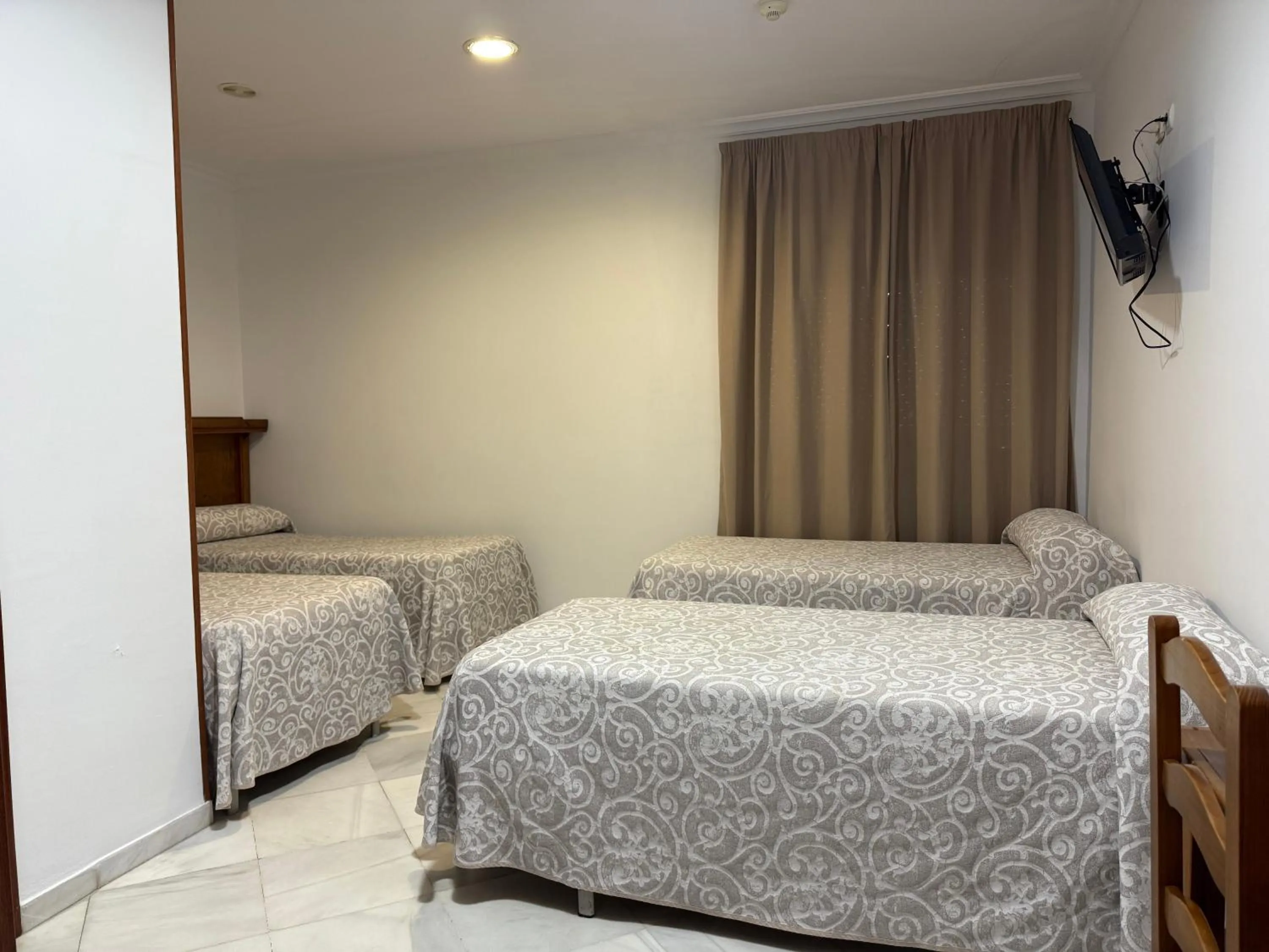 Bed in Hotel Quitagolpe