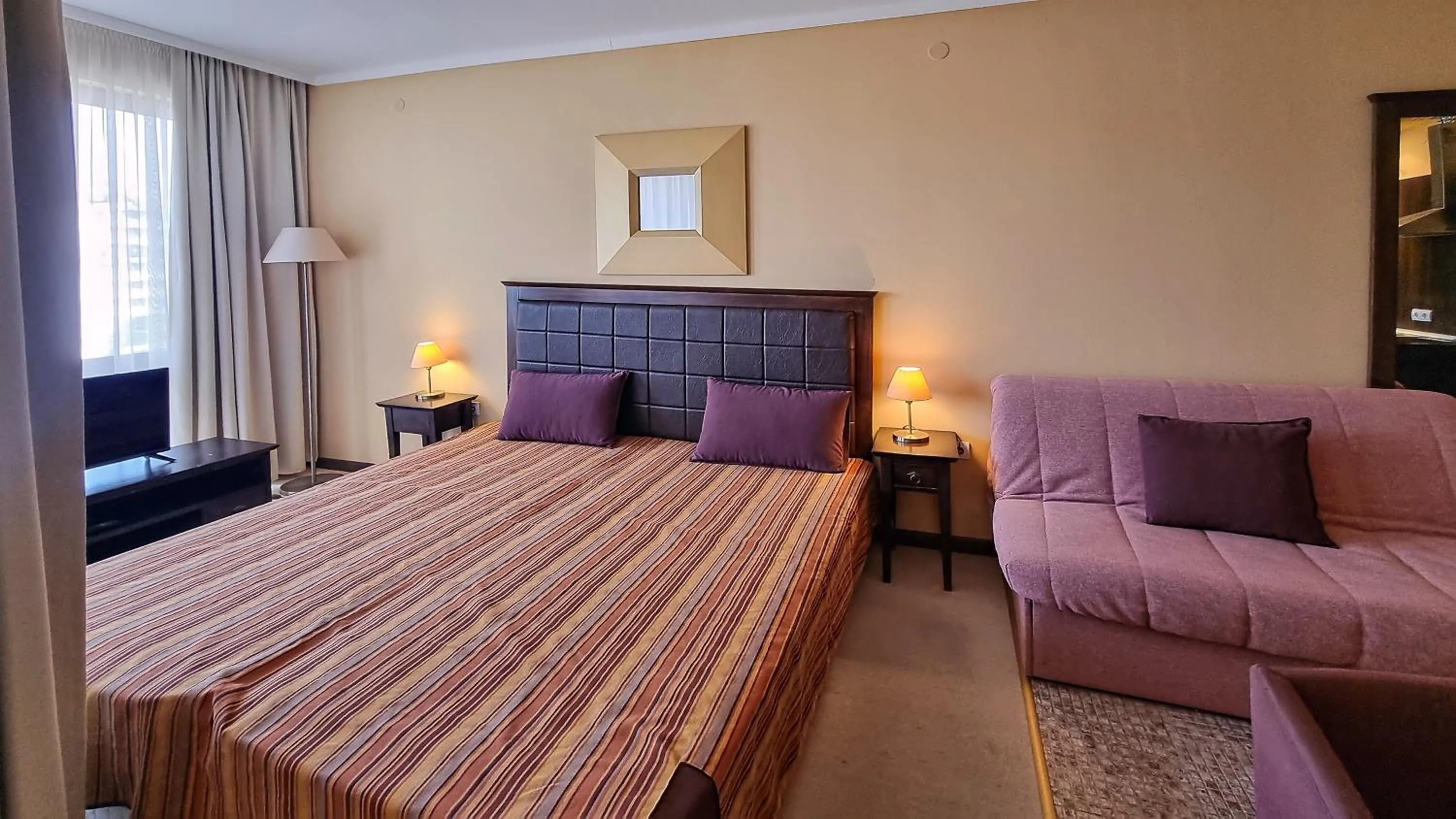Bed in Royal Beach Apartments