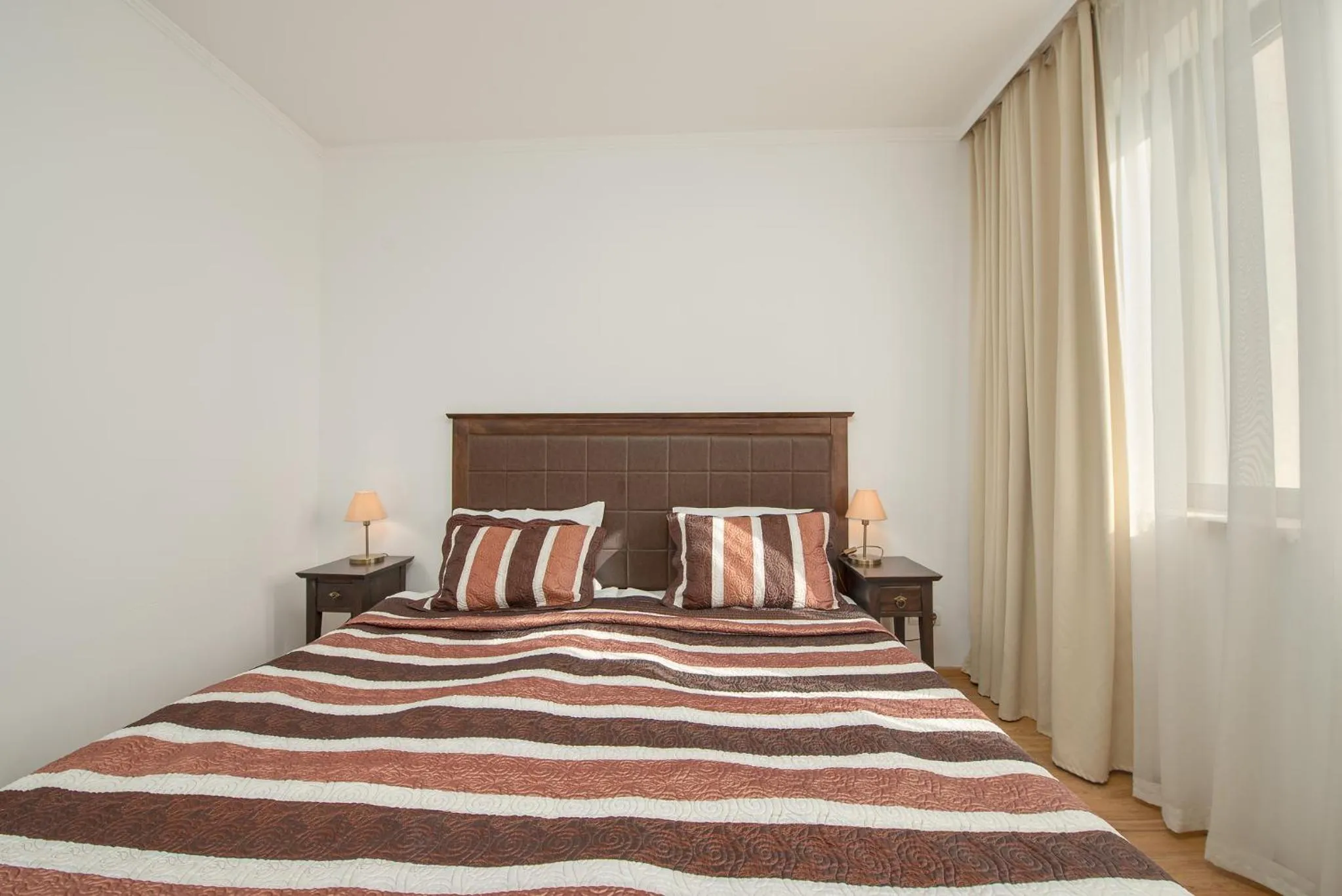 Bed in Royal Beach Apartments