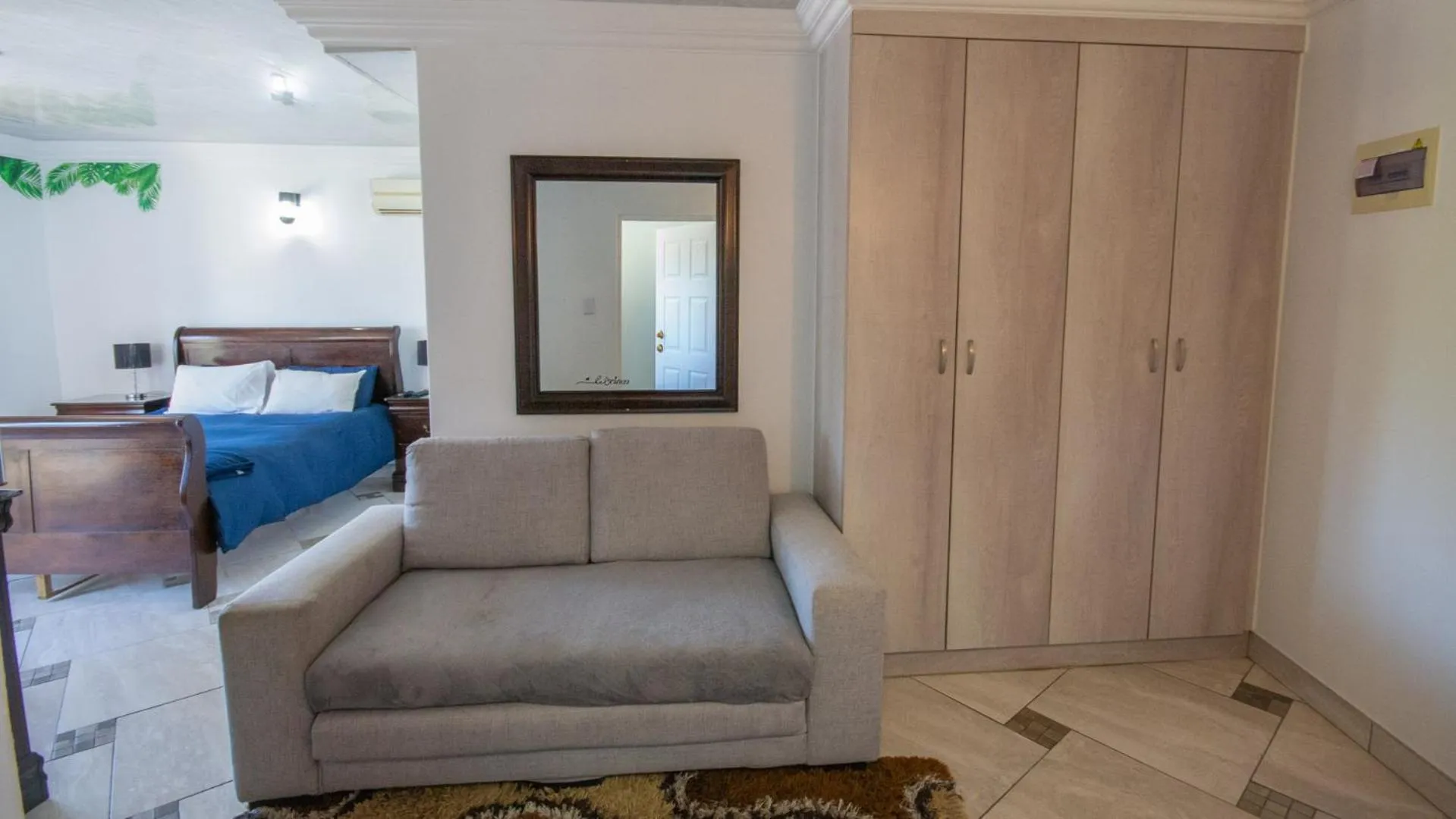 Seating area, Bed in Falling Waters Guest House