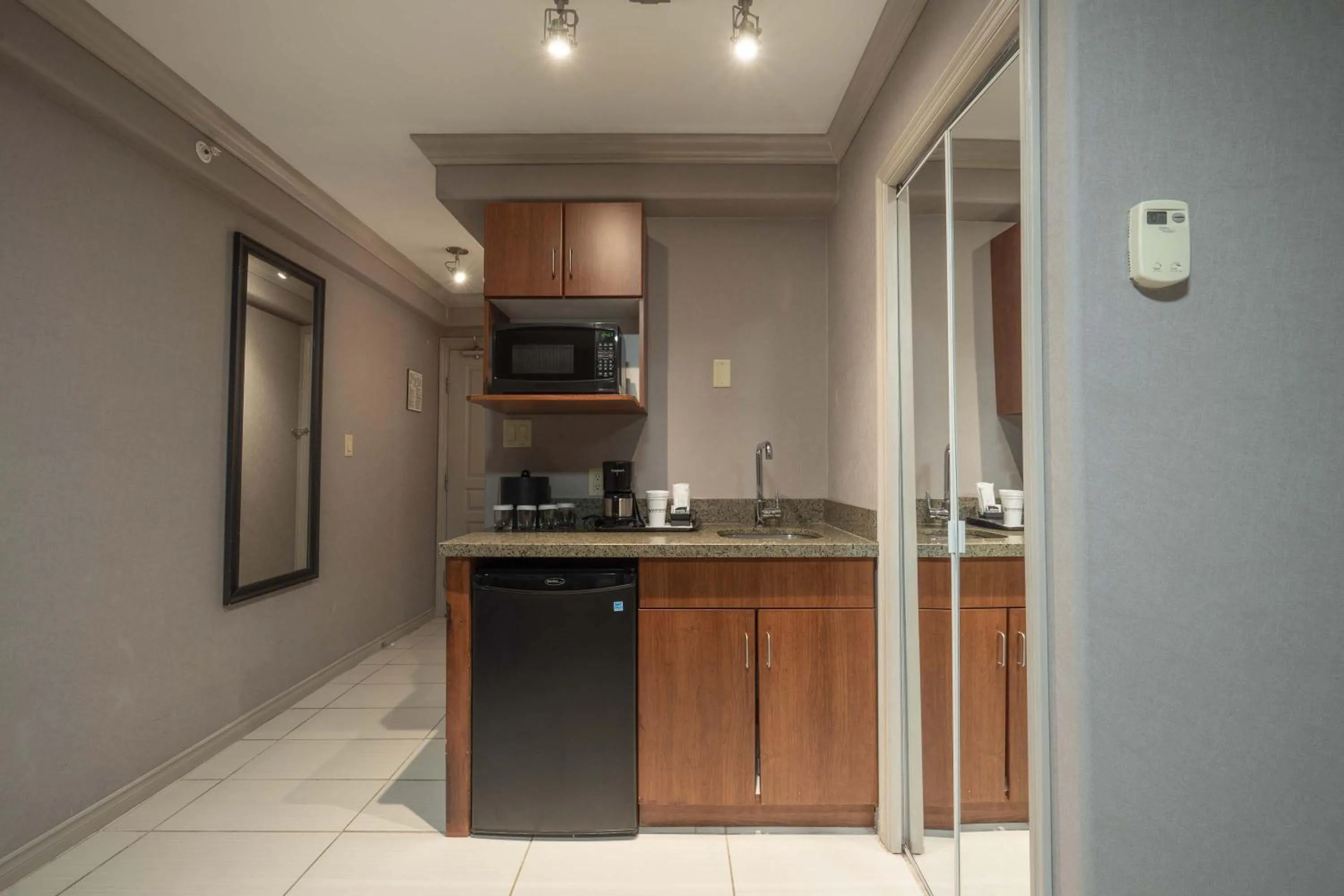 Kitchen or kitchenette in Sandman Hotel & Suites Winnipeg Airport