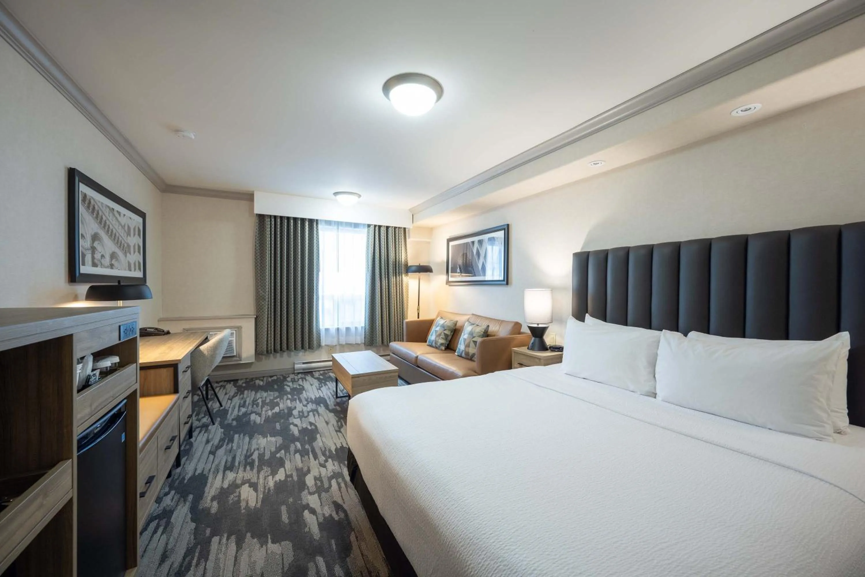 Photo of the whole room, Bed in Sandman Hotel & Suites Winnipeg Airport