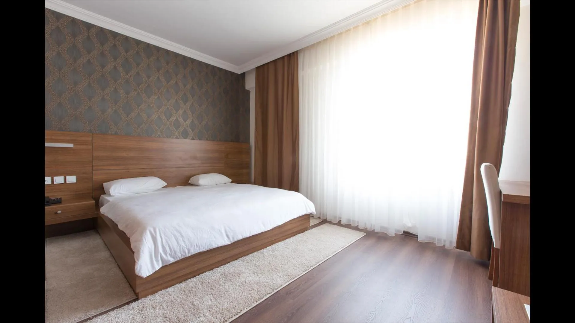 Bed in Carpediem Diamond Hotel