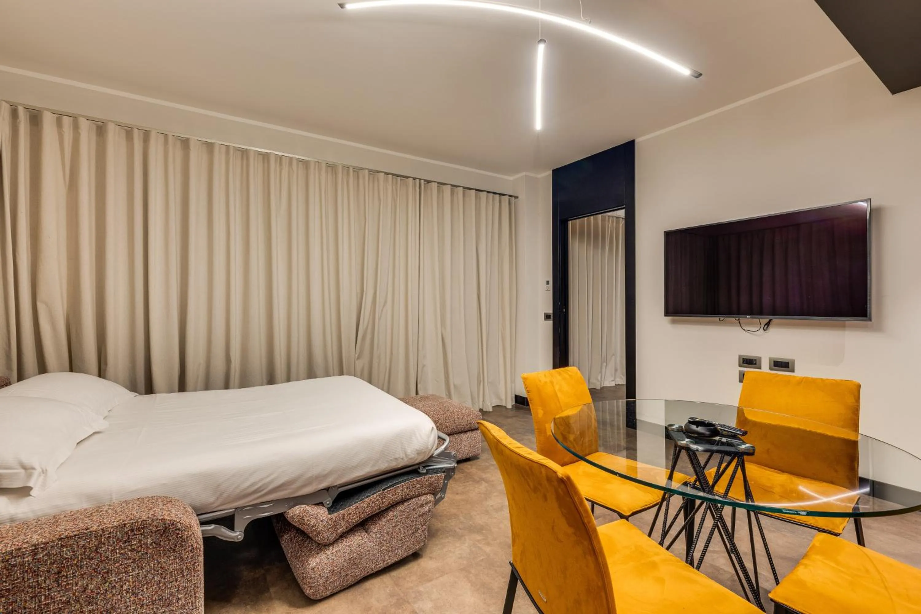 Living room, Bed in Gasometer Urban Suites