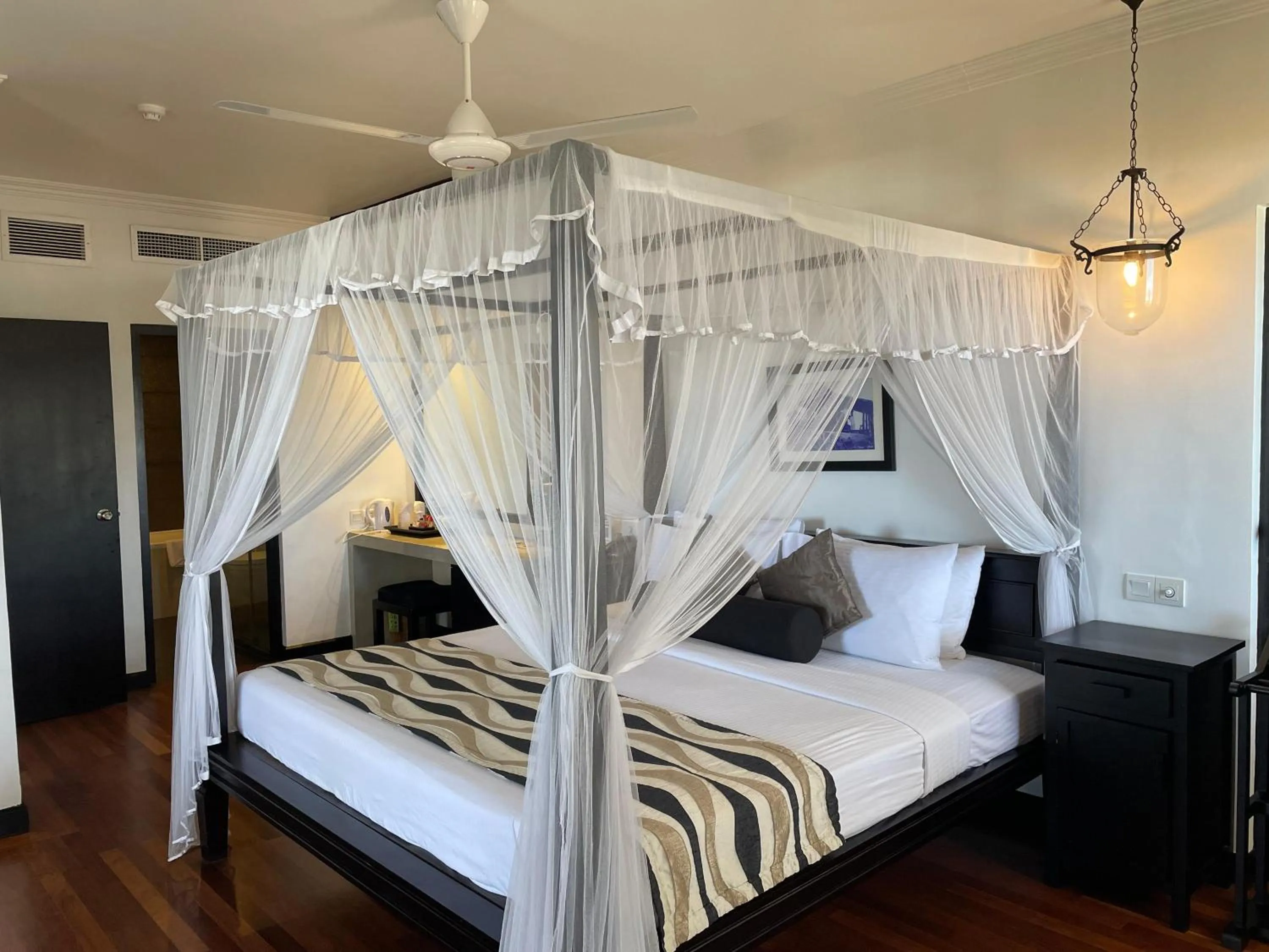 Bed in Tangerine Beach Hotel