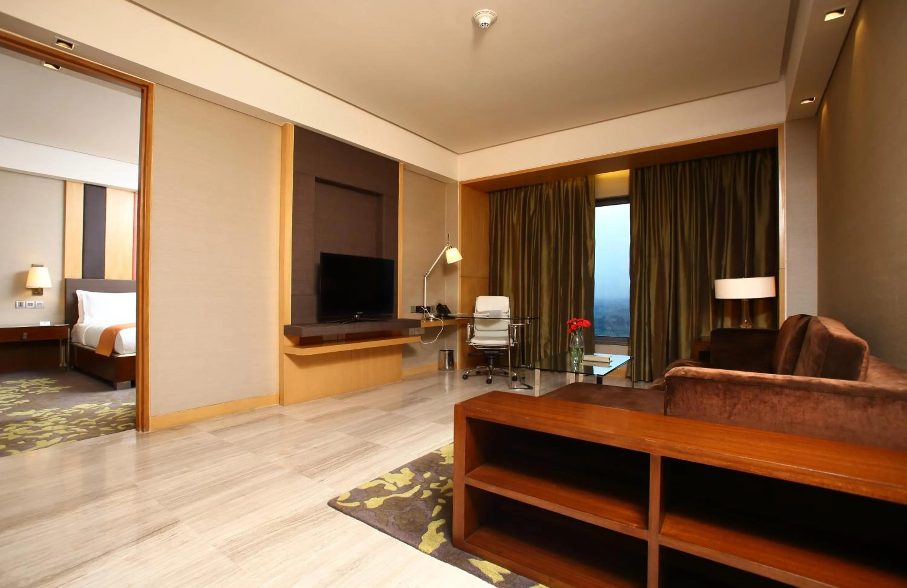 Living room, Bed in Holiday Inn New Delhi Mayur Vihar Noida by IHG