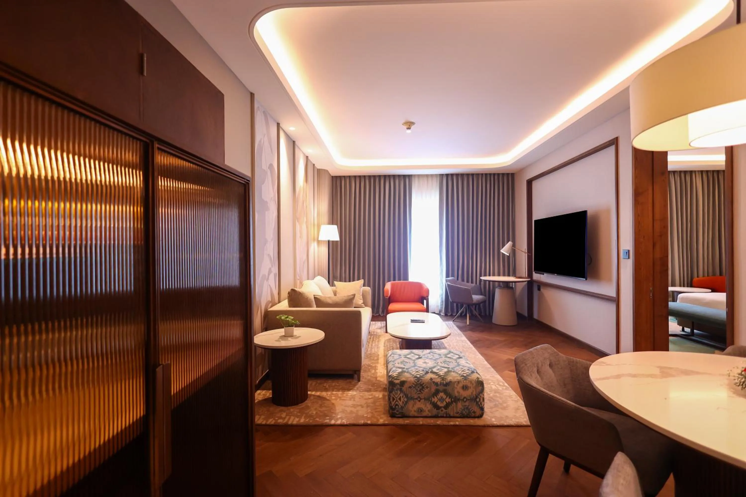 Living room, Bed in Holiday Inn New Delhi Mayur Vihar Noida by IHG