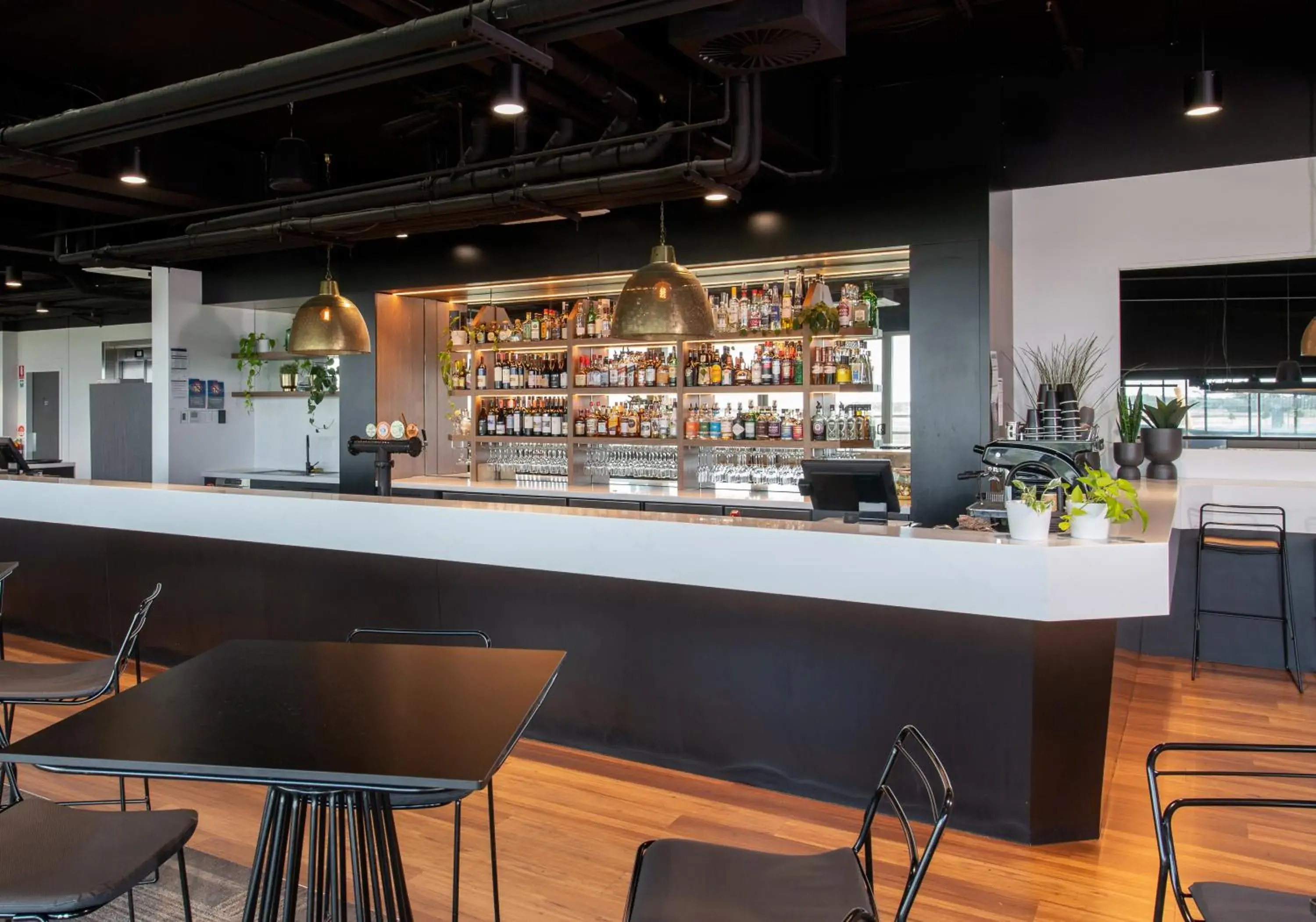Lounge or bar in Rydges Pit Lane Lounge or bar in Rydges Pit Lane