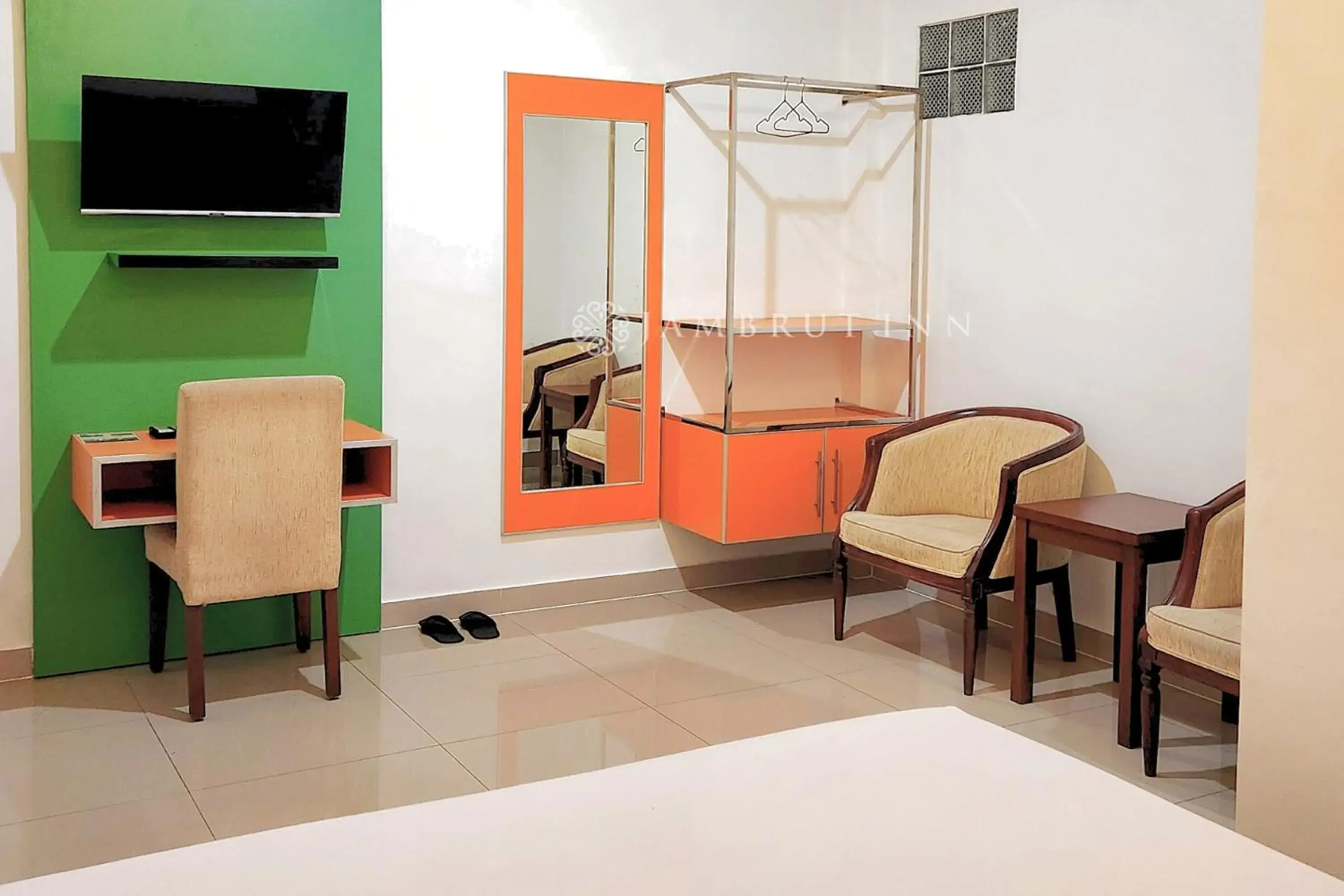 Seating area, Bed in Jambrut Inn Seating area, Bed in Jambrut Inn