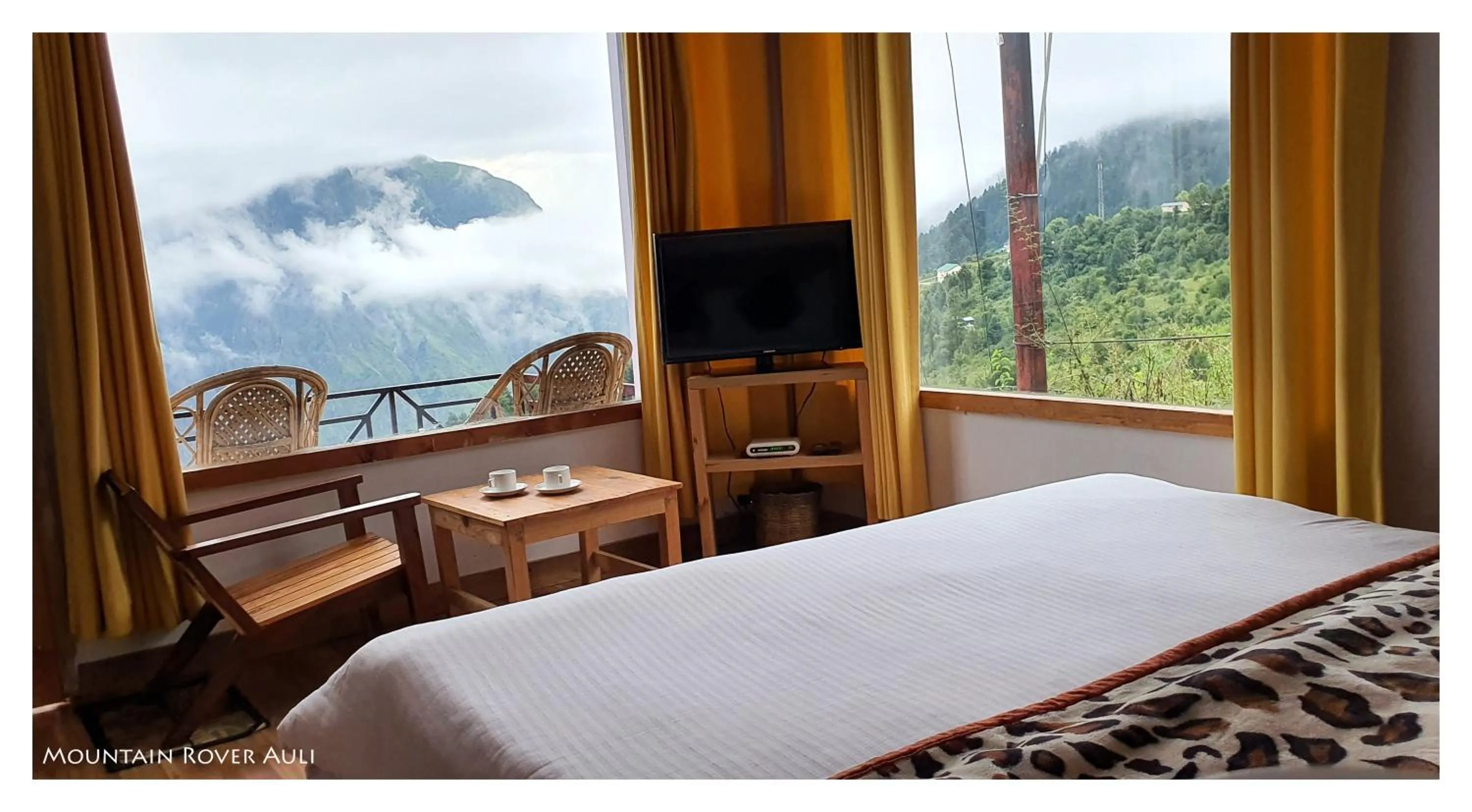 Patio, Bed in Mountain Rover Auli Resort