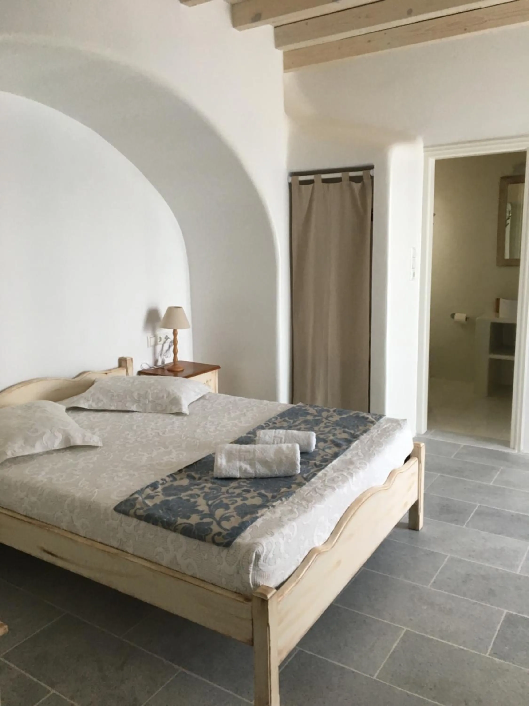 Bed in Aspasia Luxury Apartments