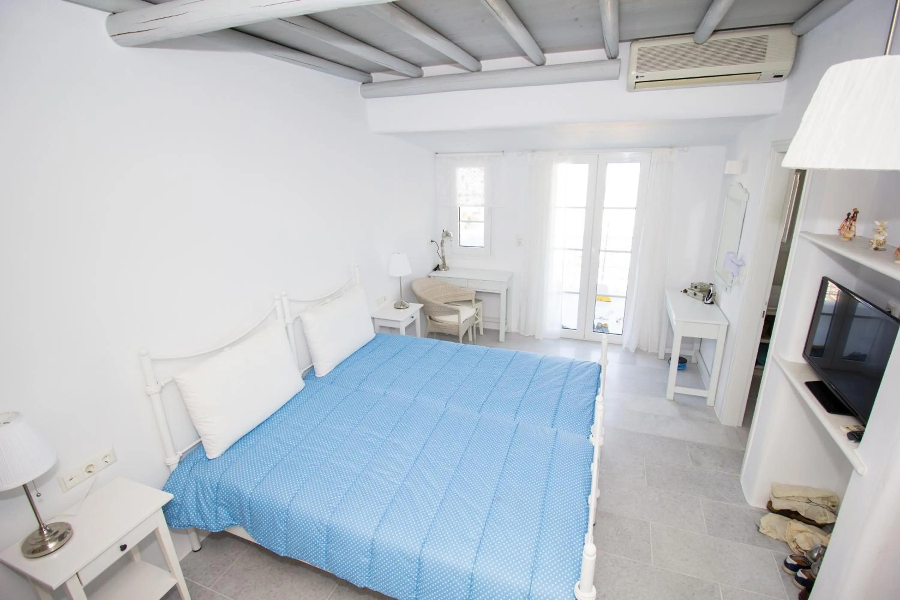 Bed in Aspasia Luxury Apartments