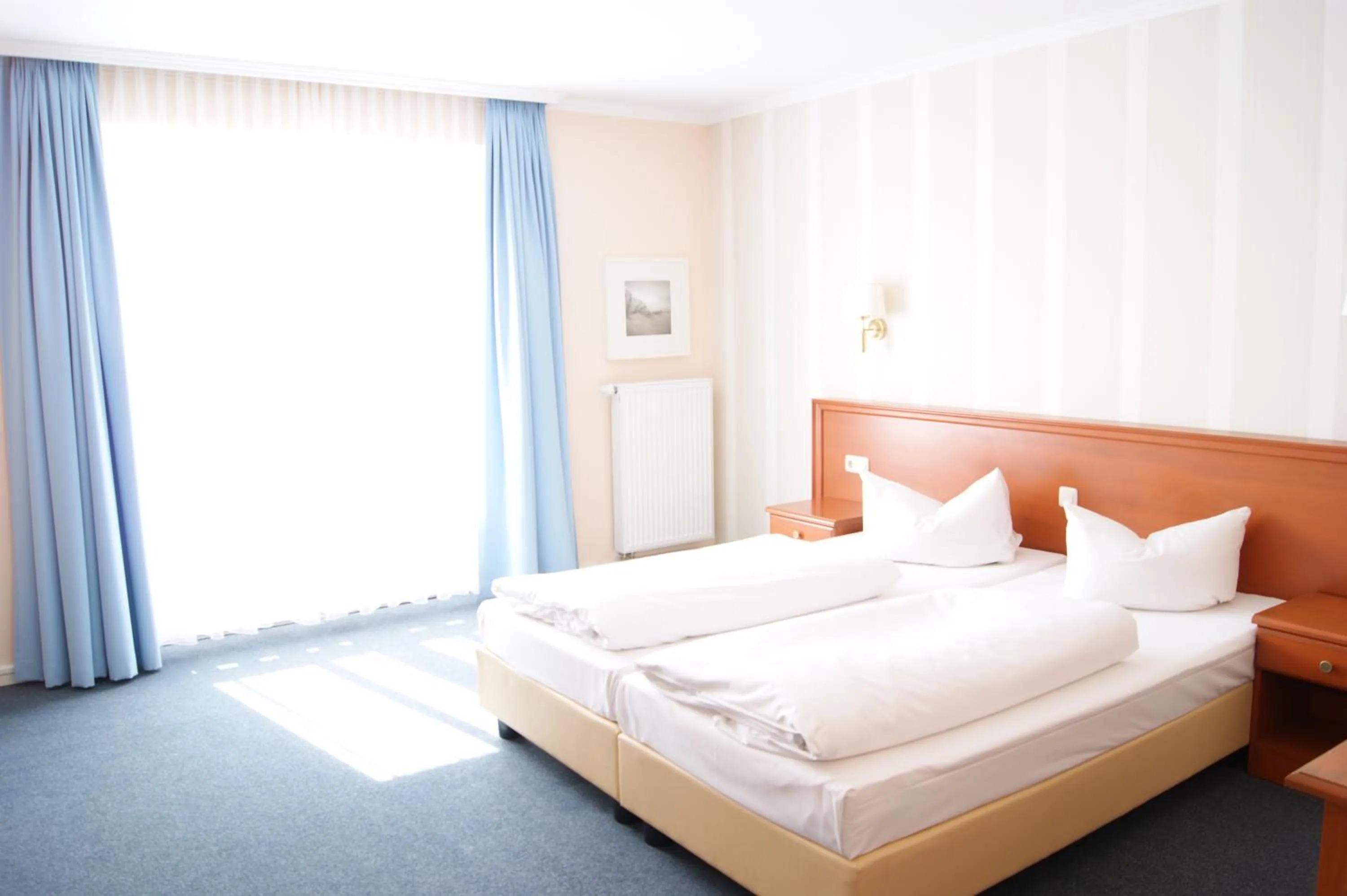 Bed in Hotel Pension Bellevue