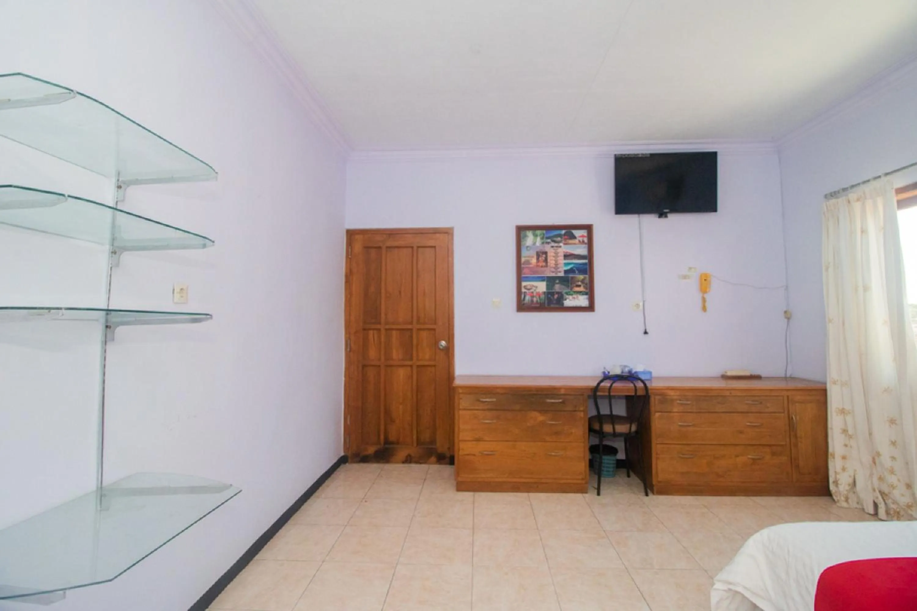 Bed in RedDoorz near Pantai Boom