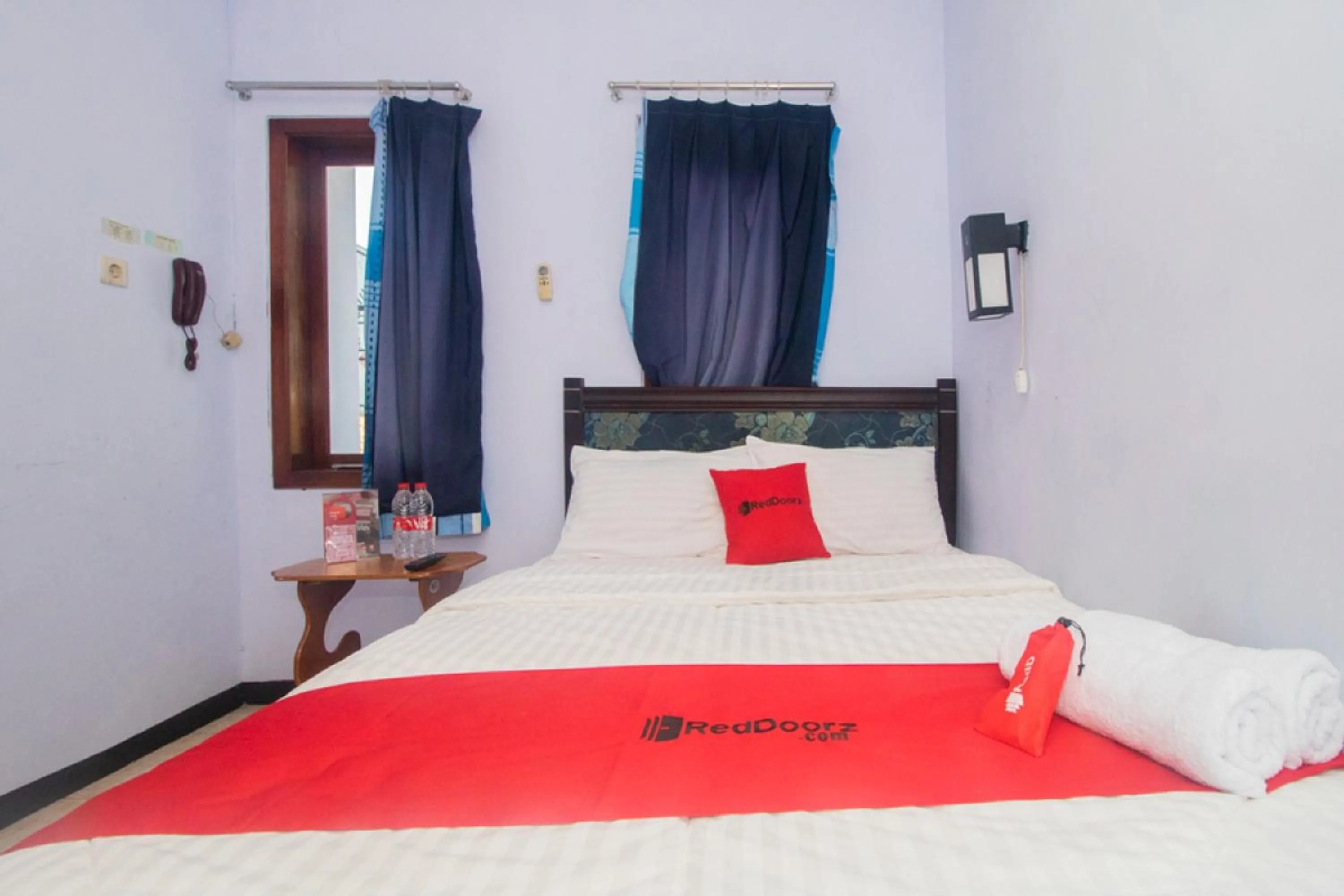 Bed in RedDoorz near Pantai Boom