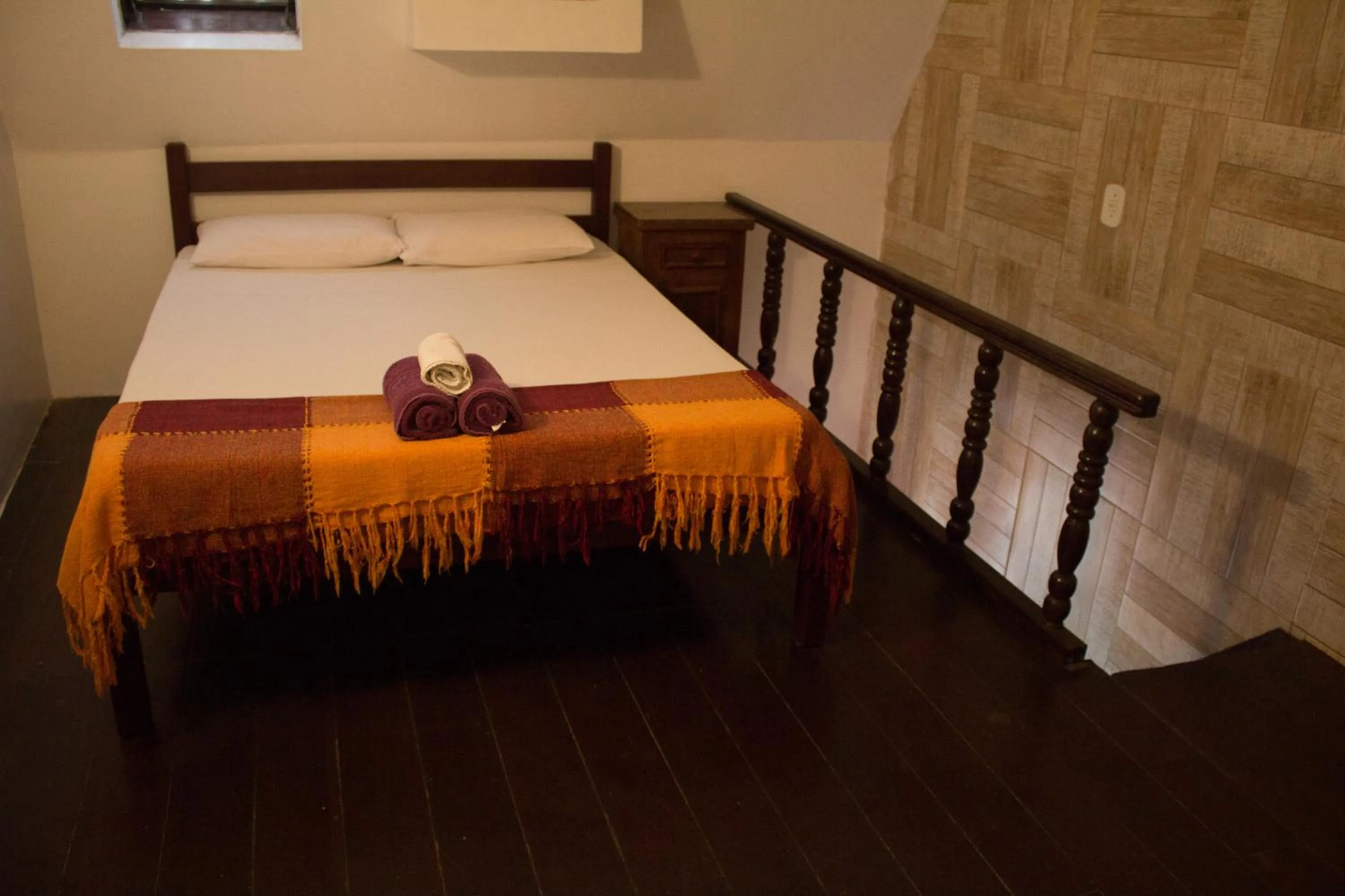 Bed in Pousada Casa da Pedra