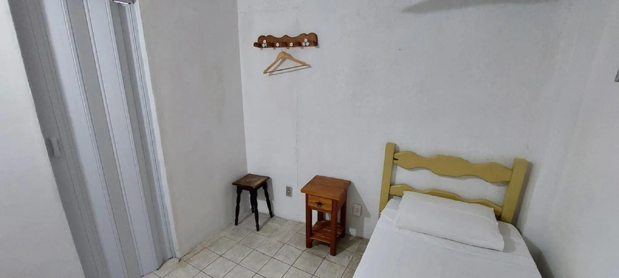 Bed in Pousada Casa da Pedra