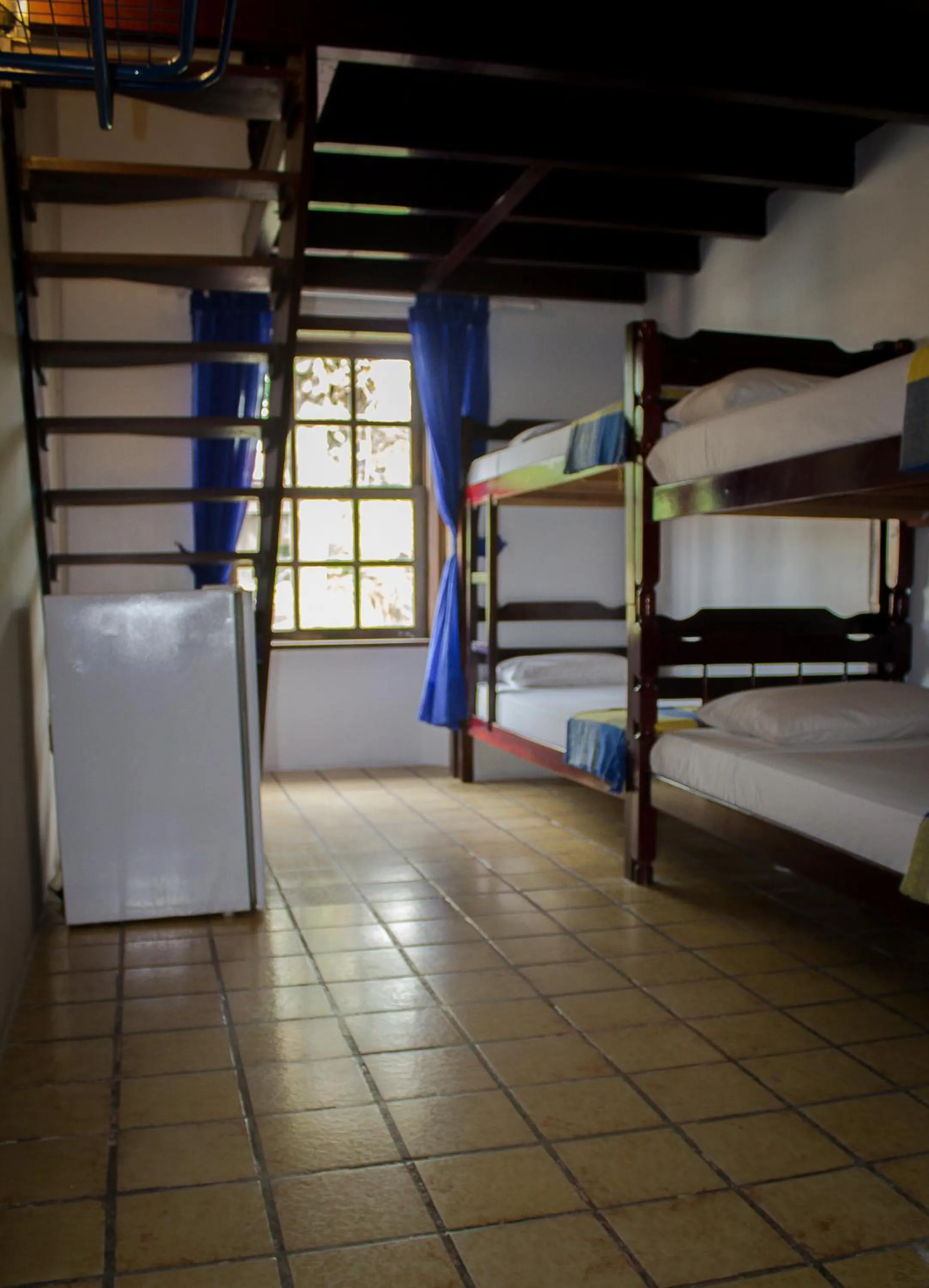 Bed in Pousada Casa da Pedra