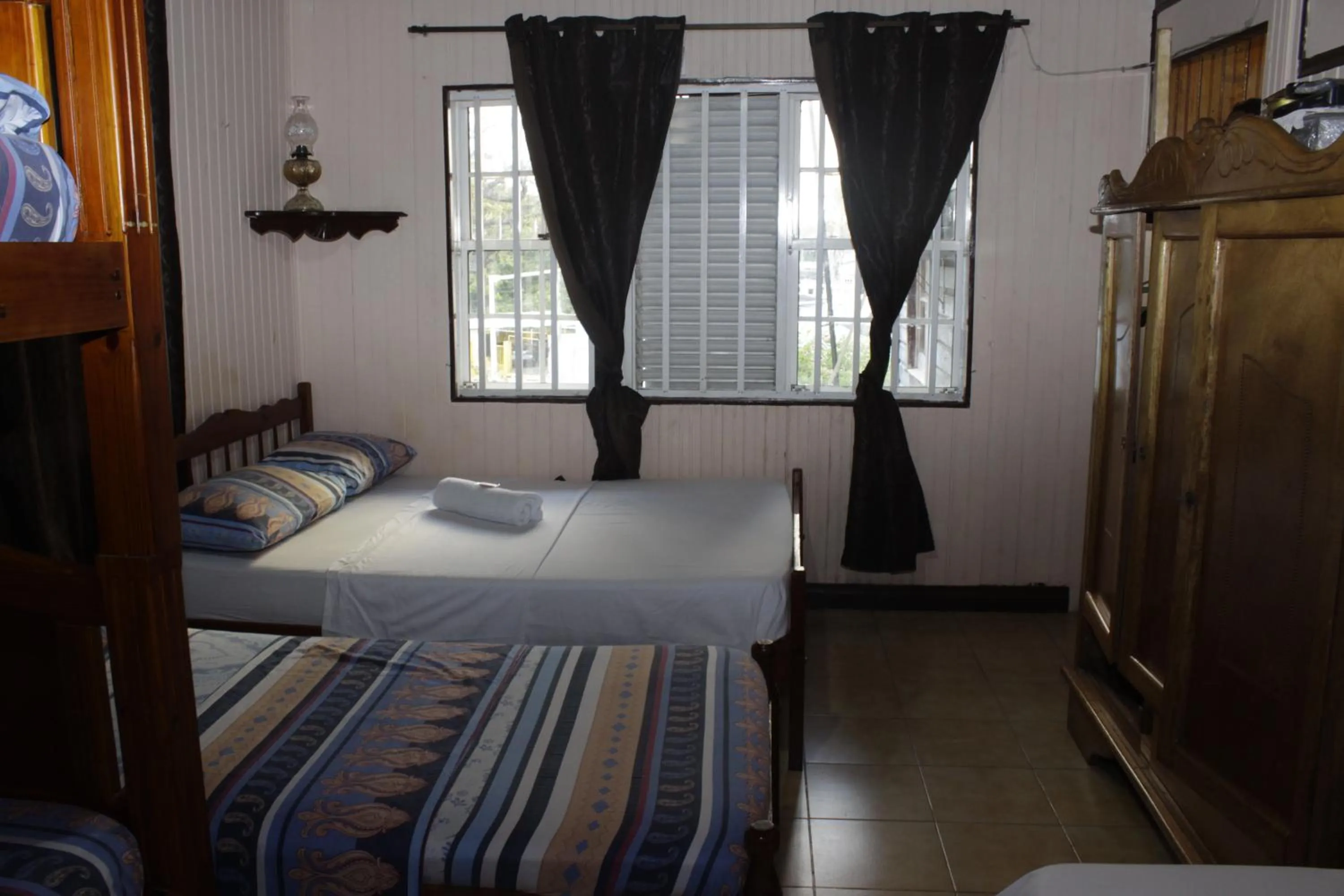 Bed in Posada Nativa Miss Trinie