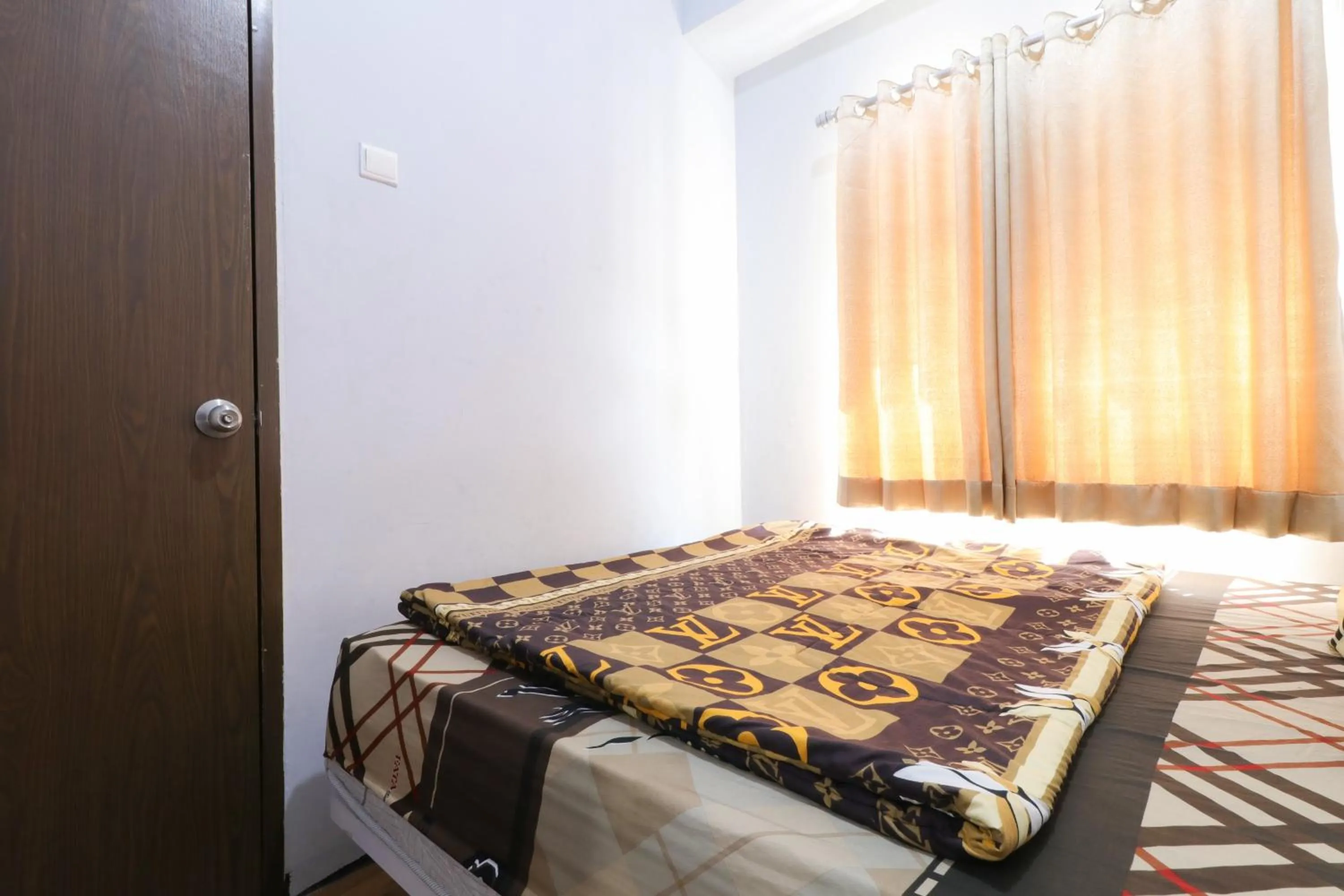 Bedroom, Bed in The Suite Metro Apartment by King Official