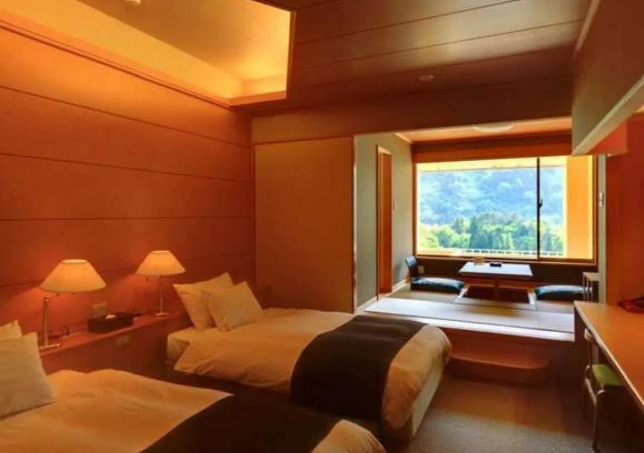 Bed in Marumine Kanko Hotel