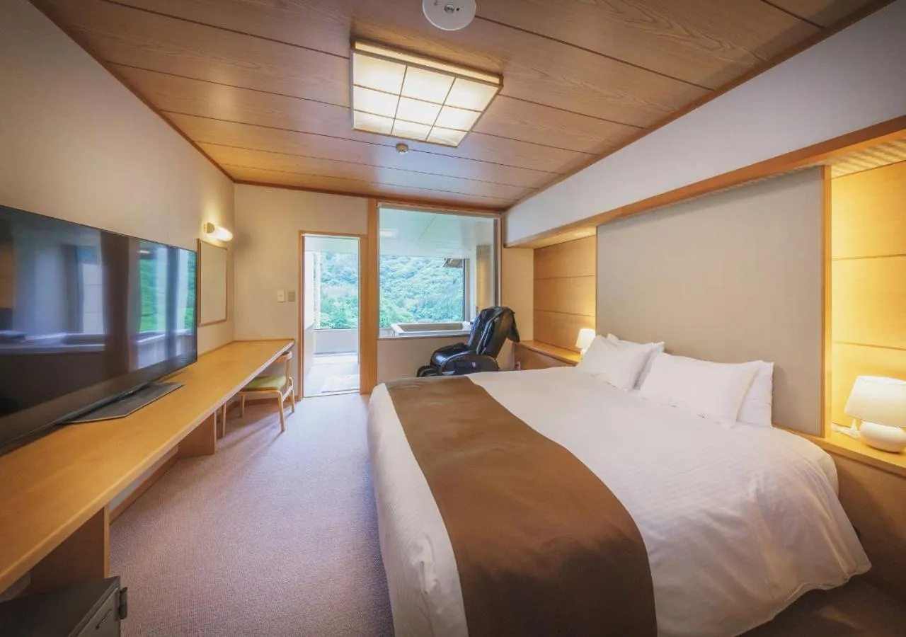 Bed in Marumine Kanko Hotel