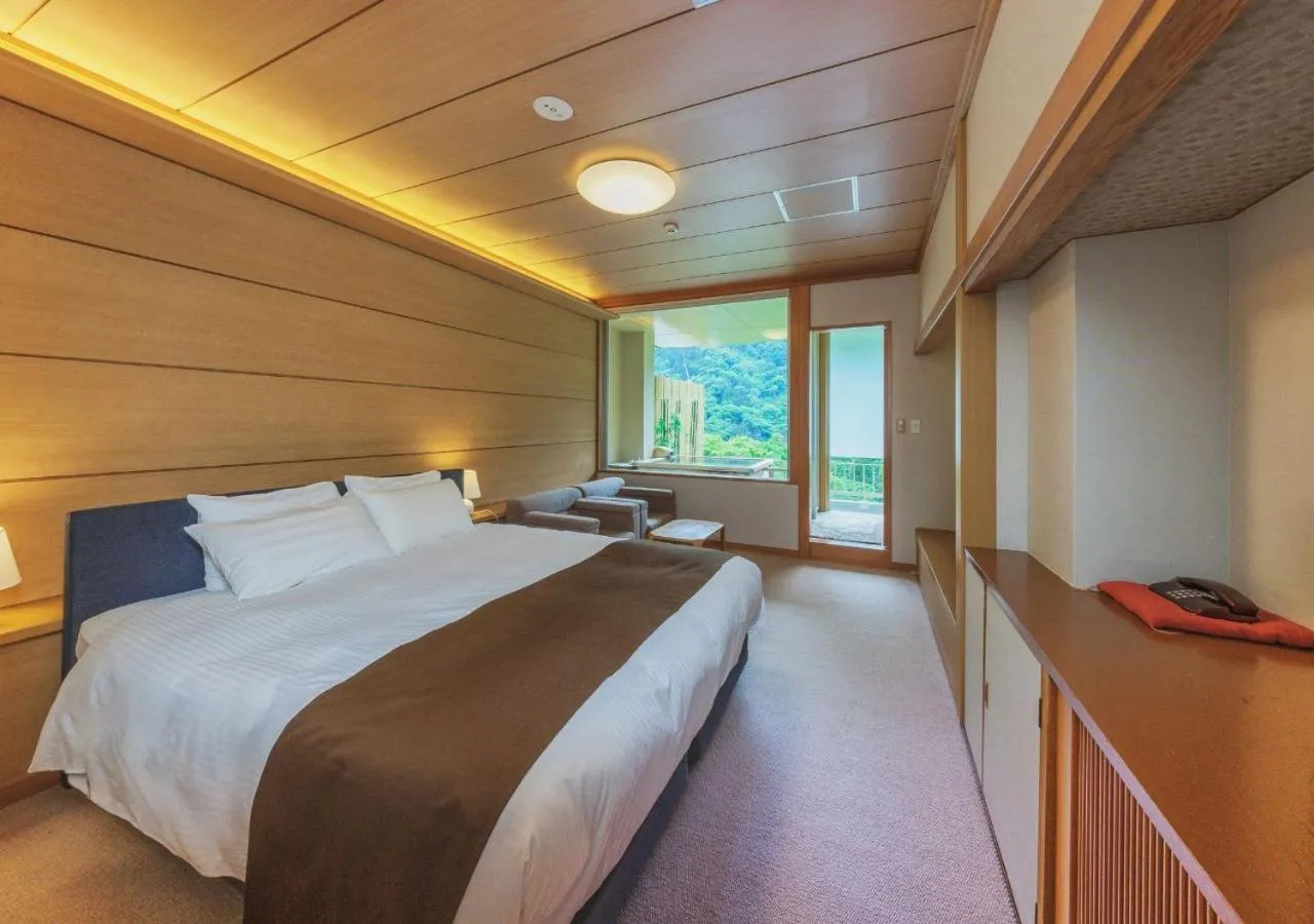 Bed in Marumine Kanko Hotel