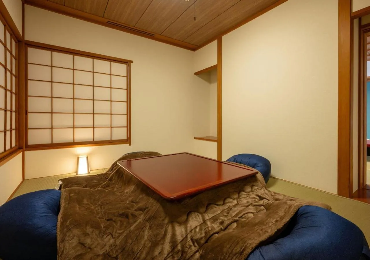 Bed in Marumine Kanko Hotel