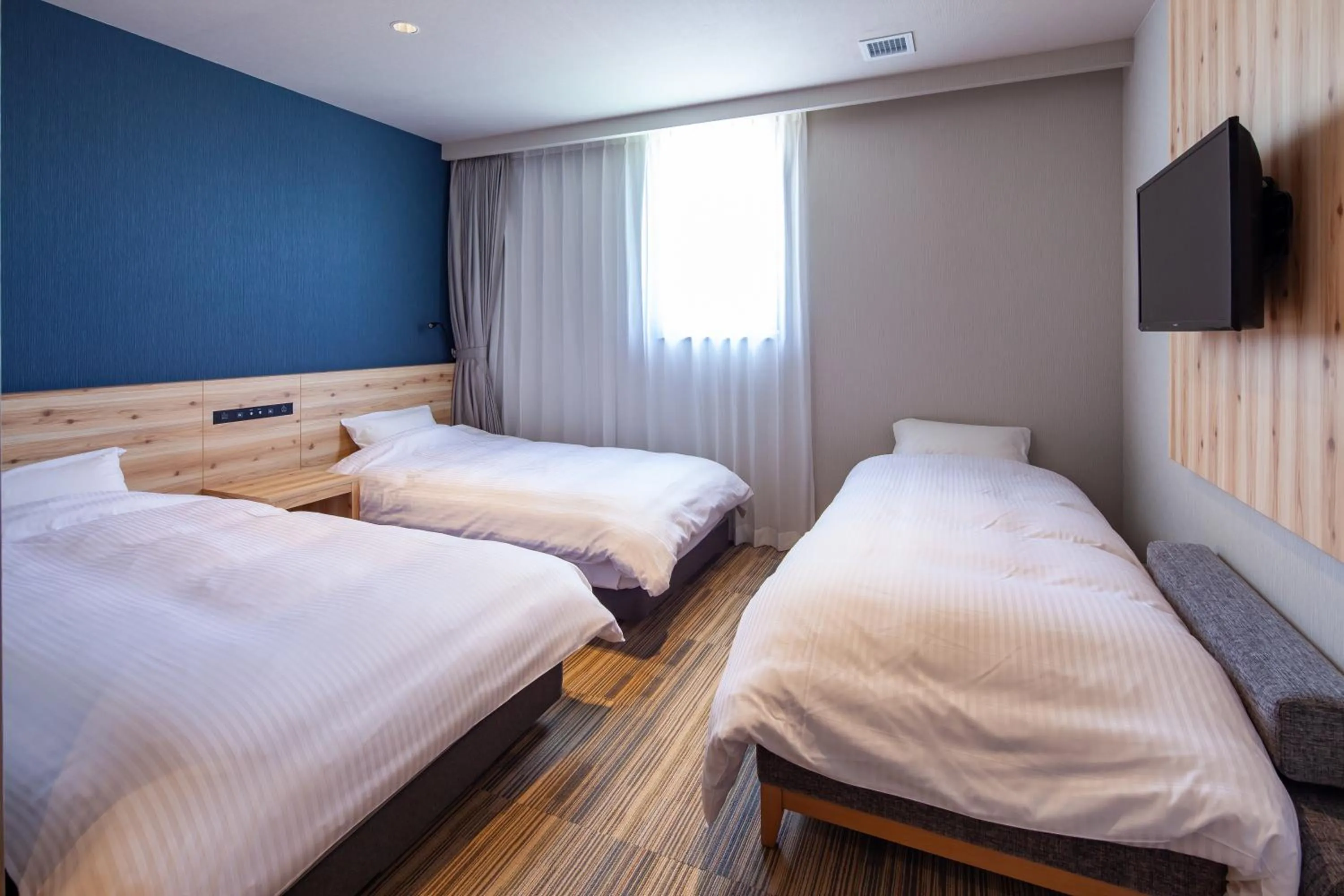 Photo of the whole room, Bed in Y's CABIN&HOTEL Naha Kokusai Street