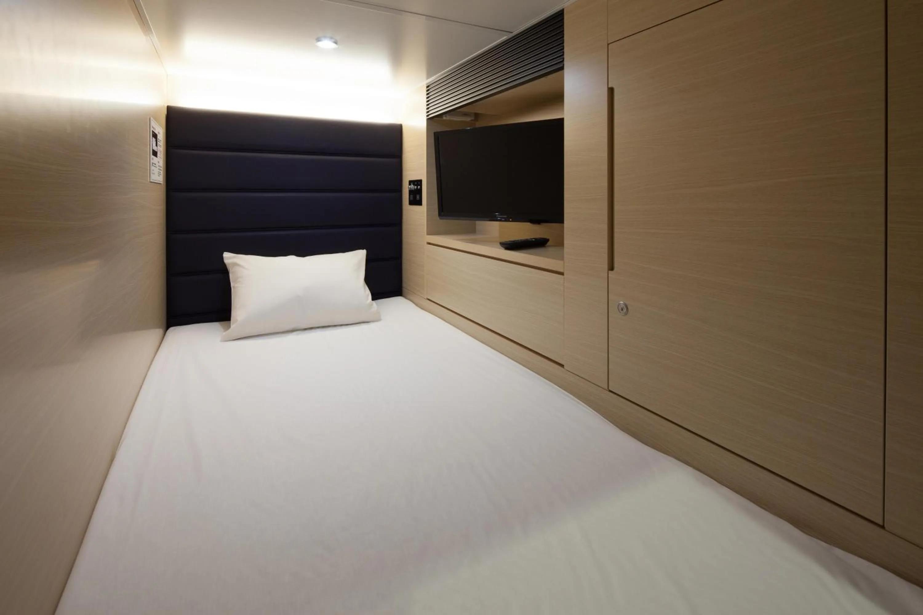 Bed in Y's CABIN&HOTEL Naha Kokusai Street