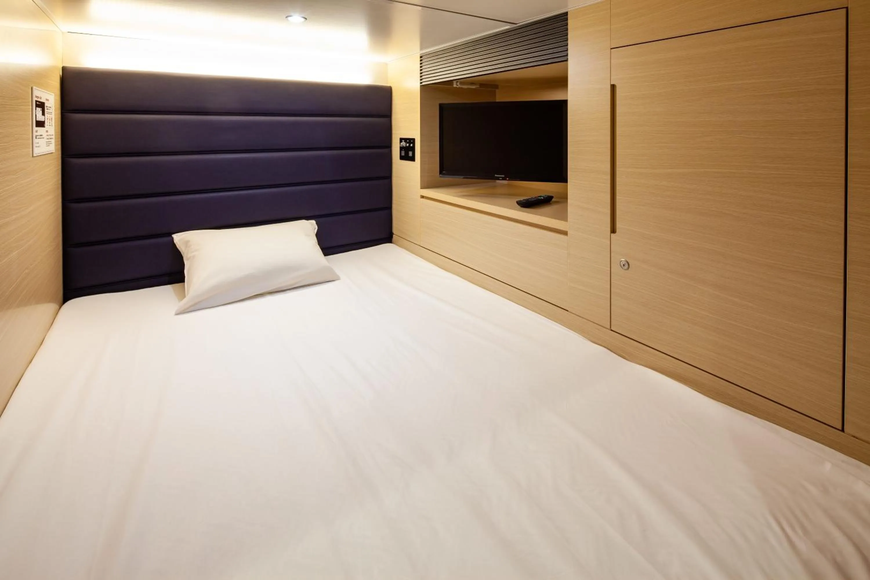 Bed in Y's CABIN&HOTEL Naha Kokusai Street