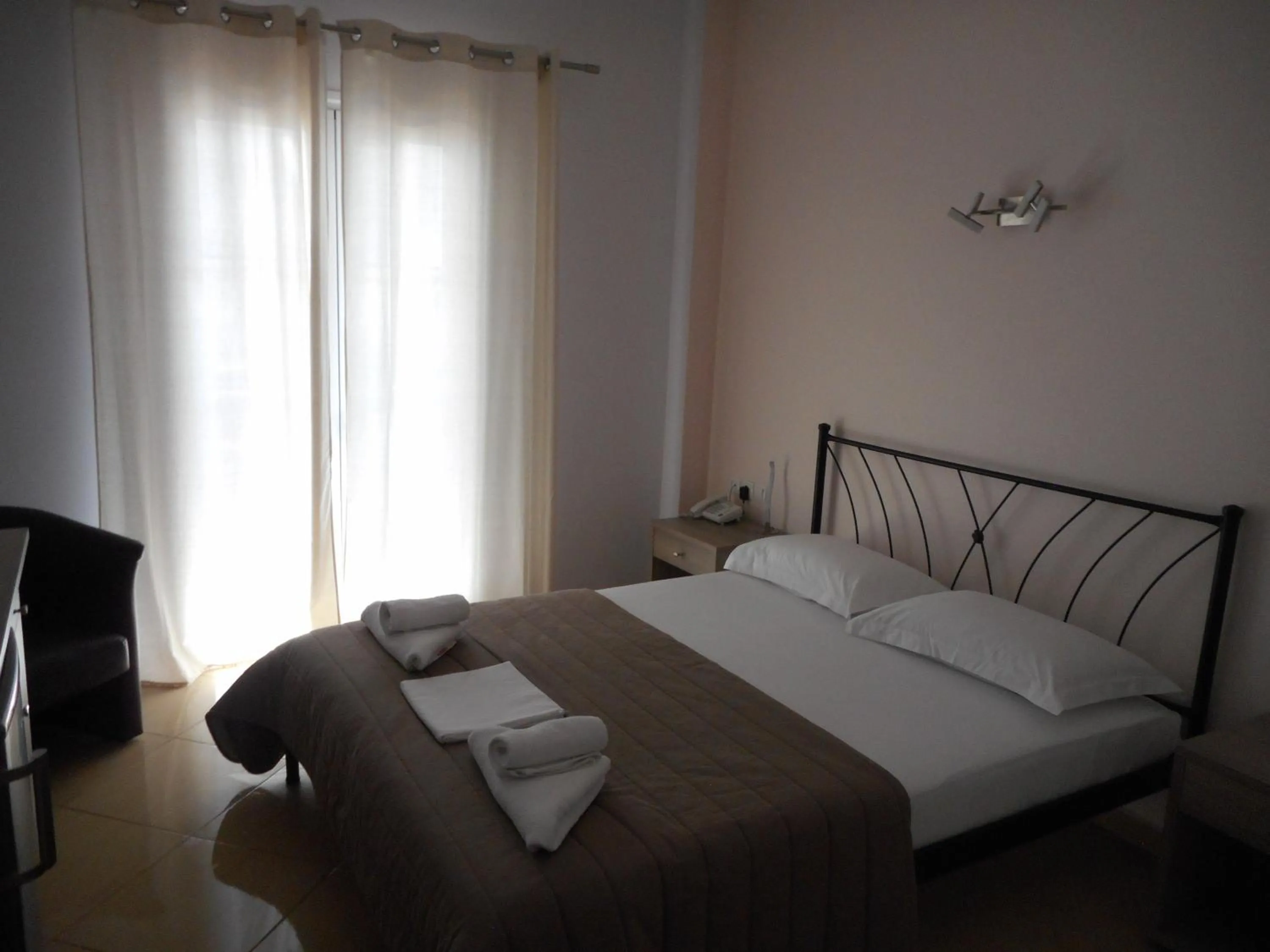 Bed in Anesis Hotel