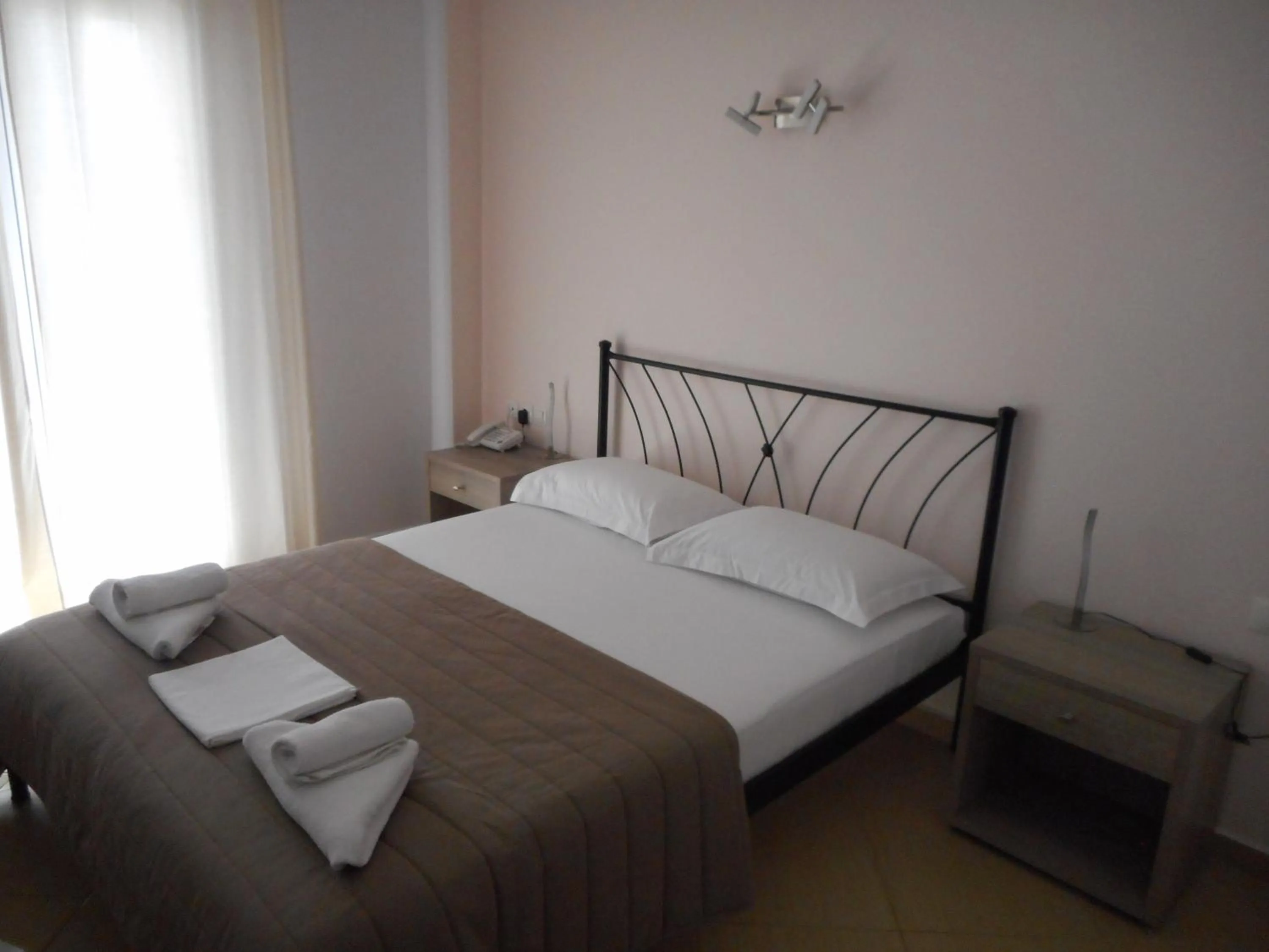 Bed in Anesis Hotel