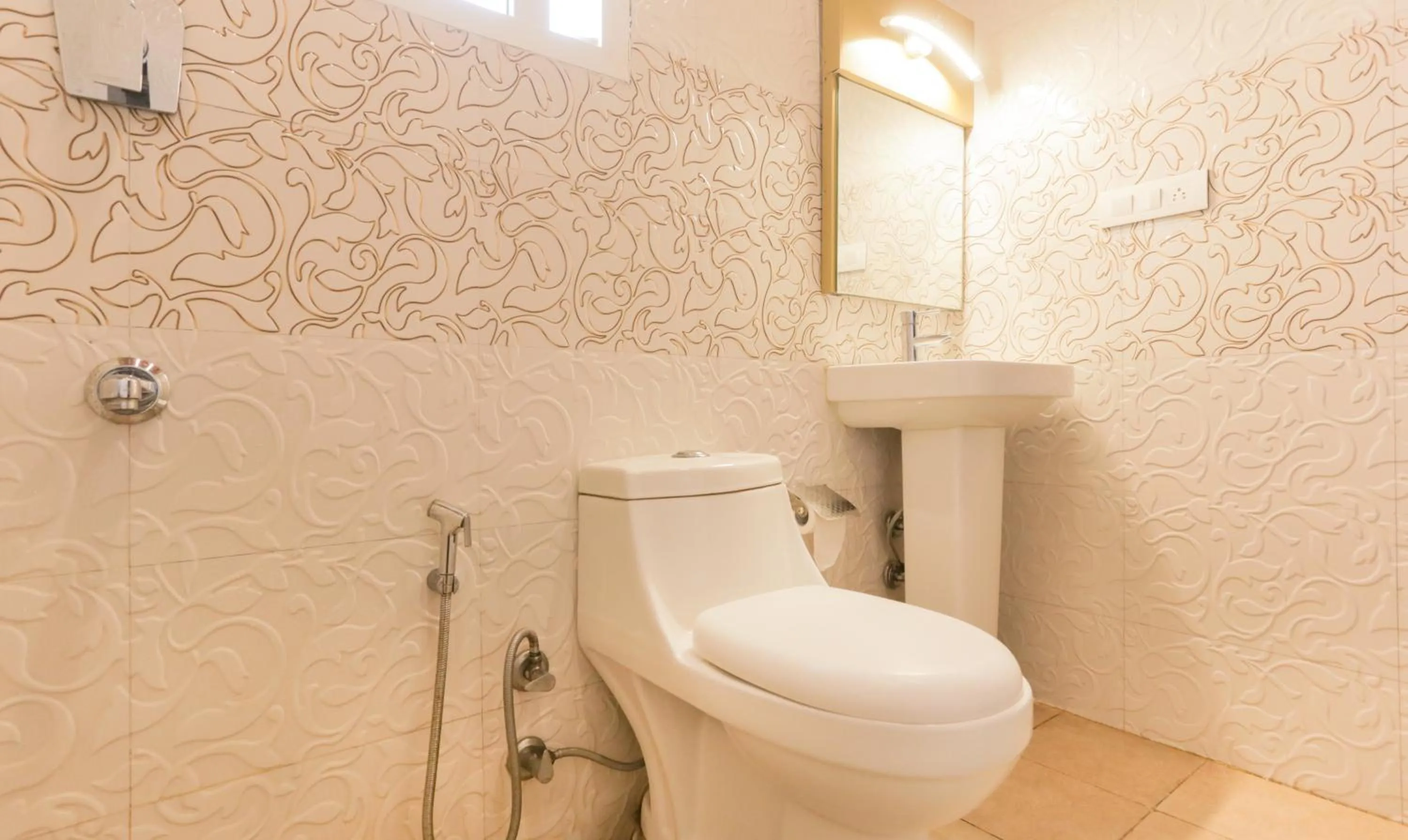 Toilet in Hotel Dvaraka Inn