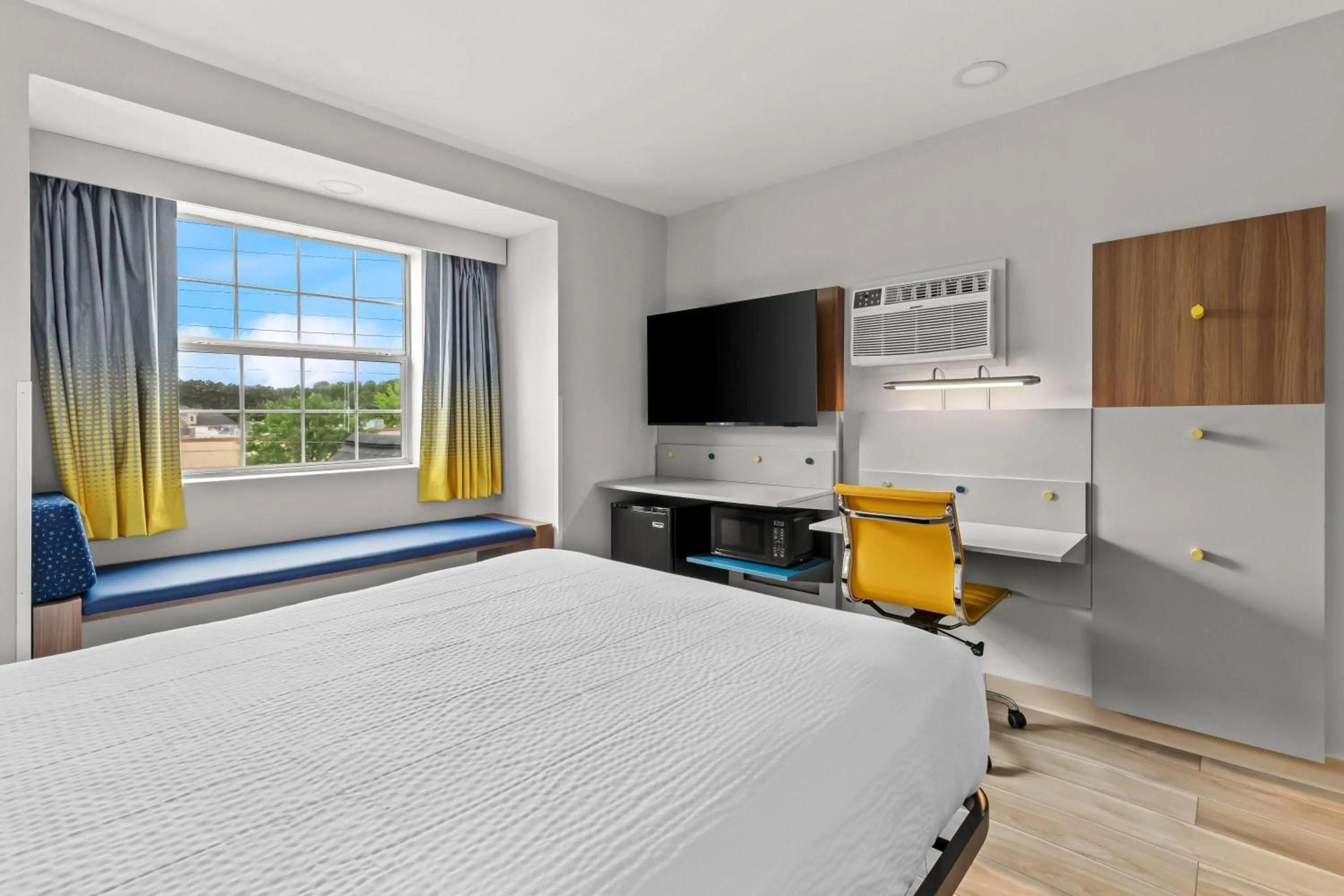 Bed in Microtel Inn & Suites by Wyndham Norcross