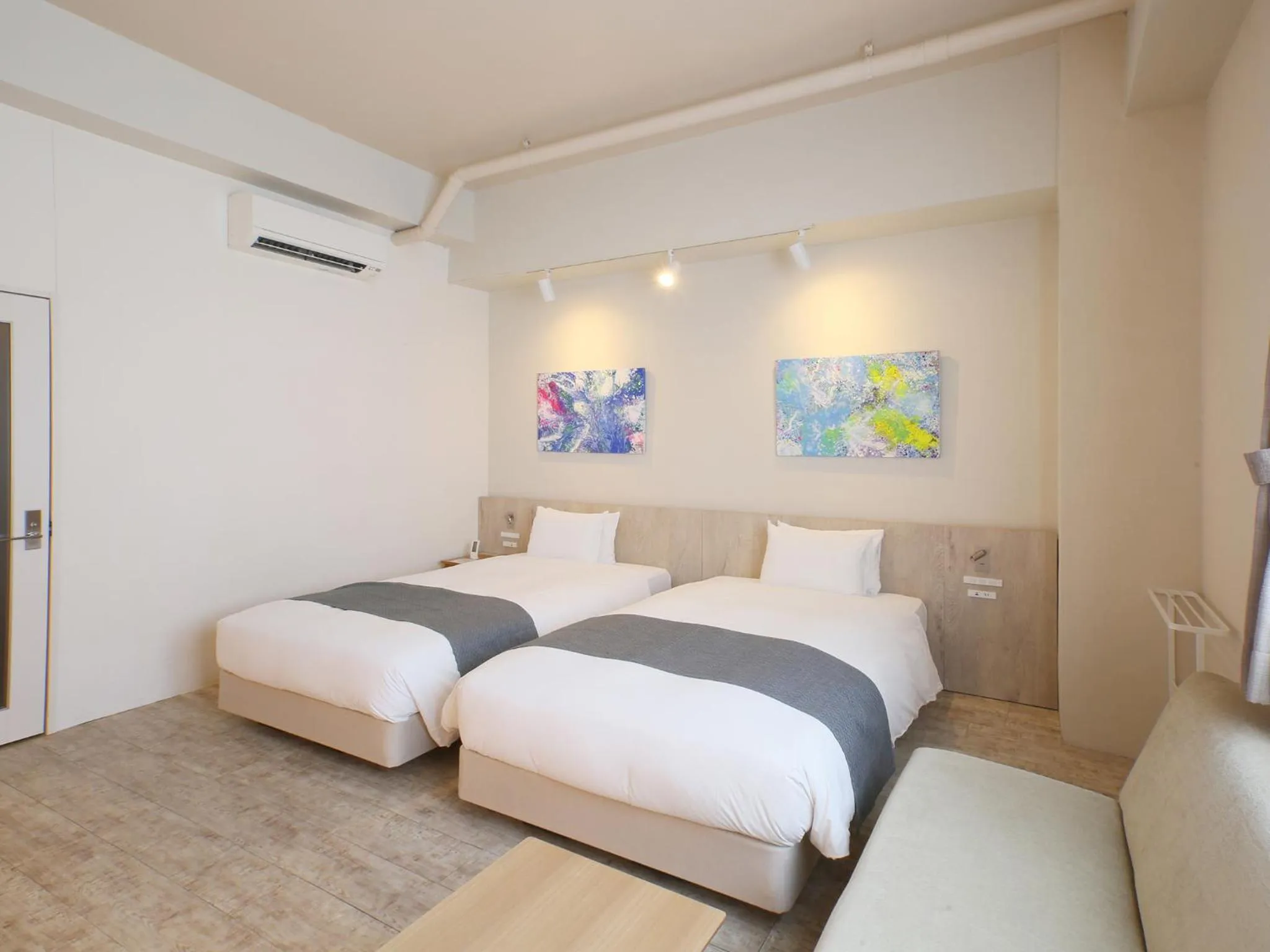 Bed in Ishigakijima Hotel Cucule