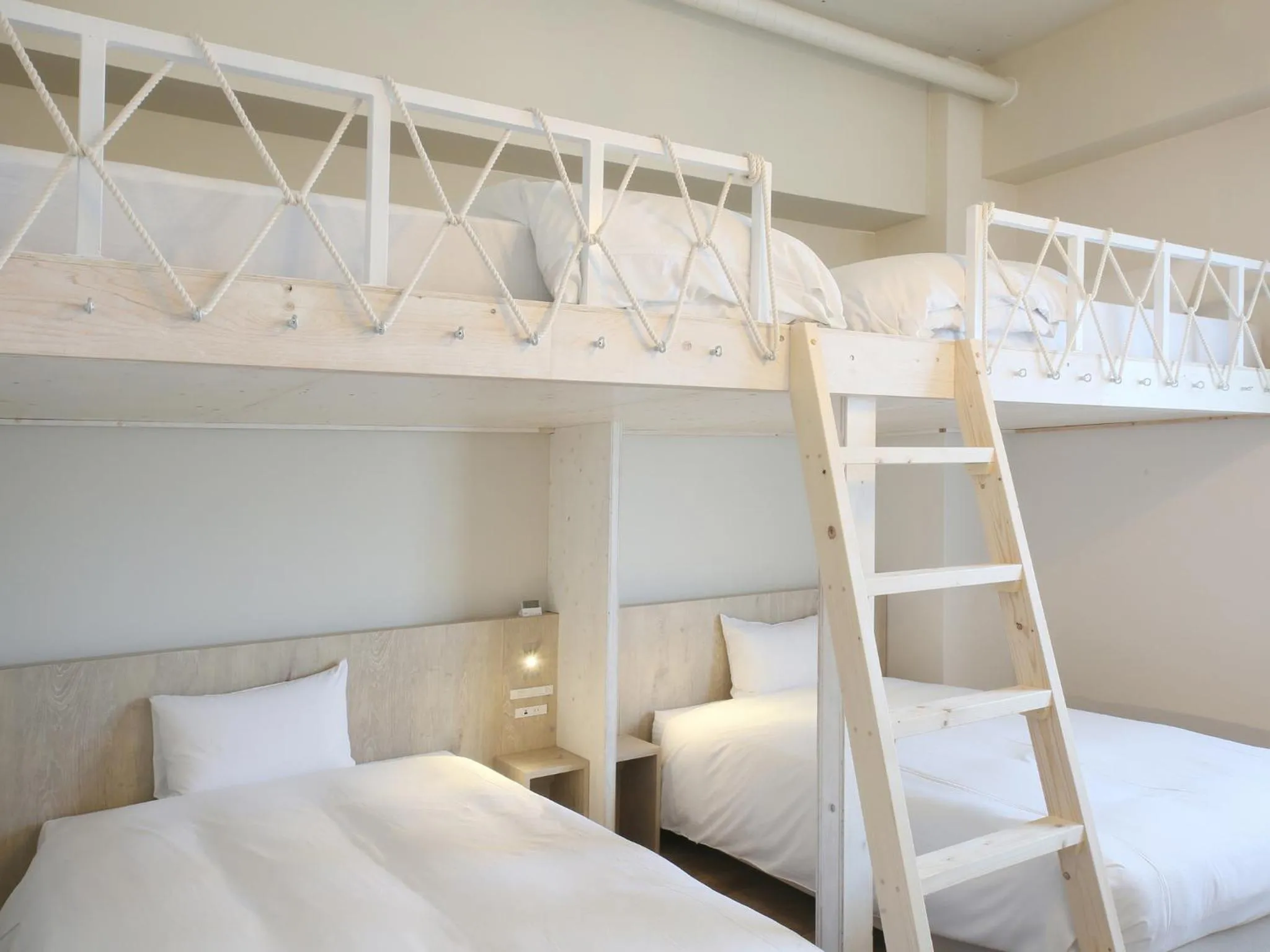 Bed in Ishigakijima Hotel Cucule