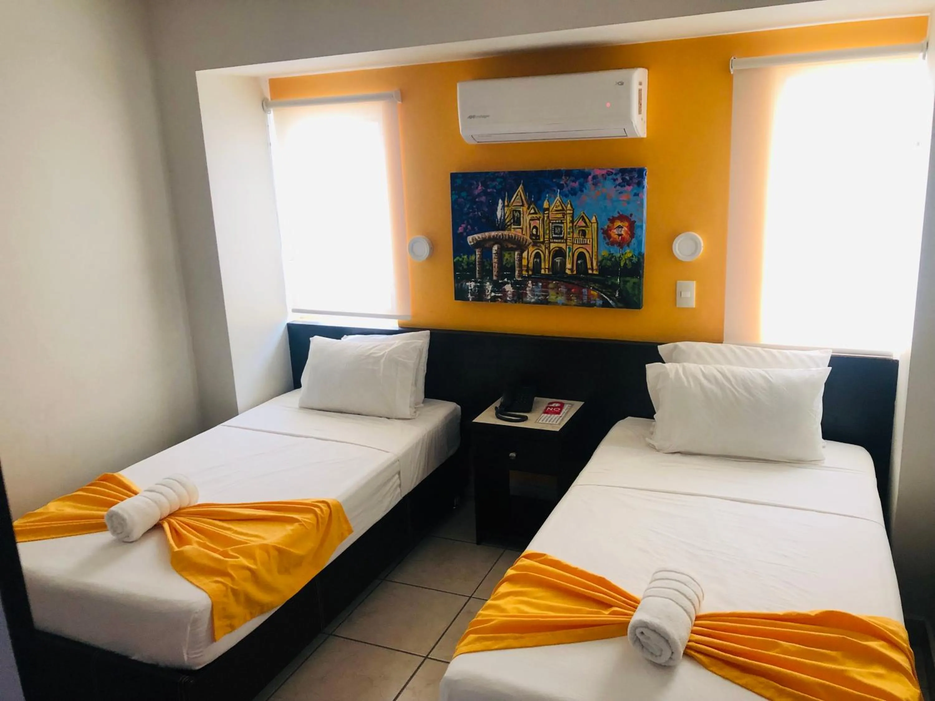 Bed in Hotel Belisario INN