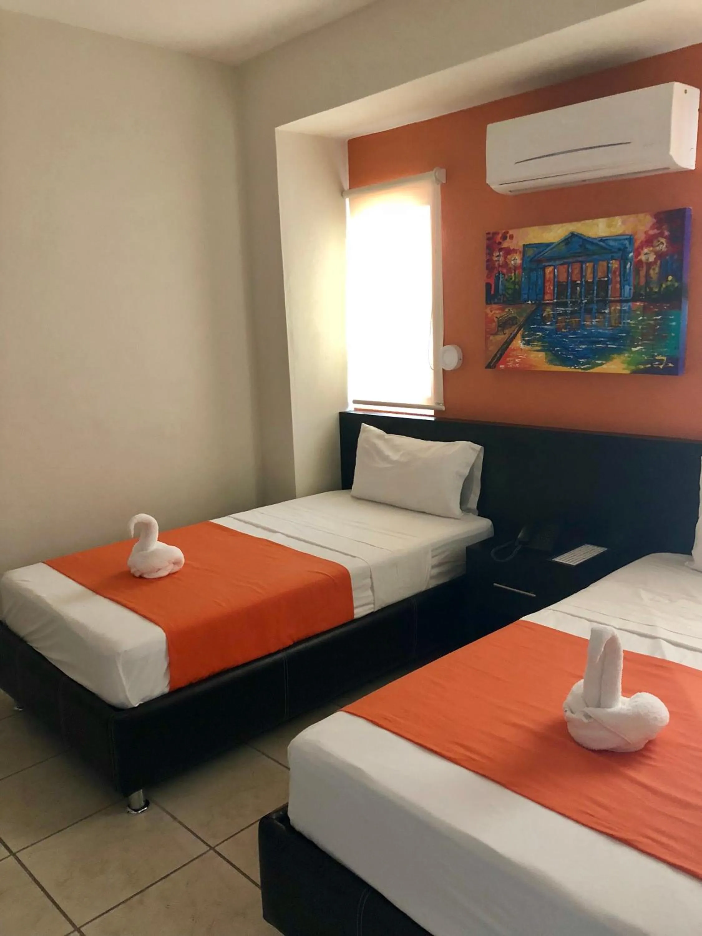Bed in Hotel Belisario INN