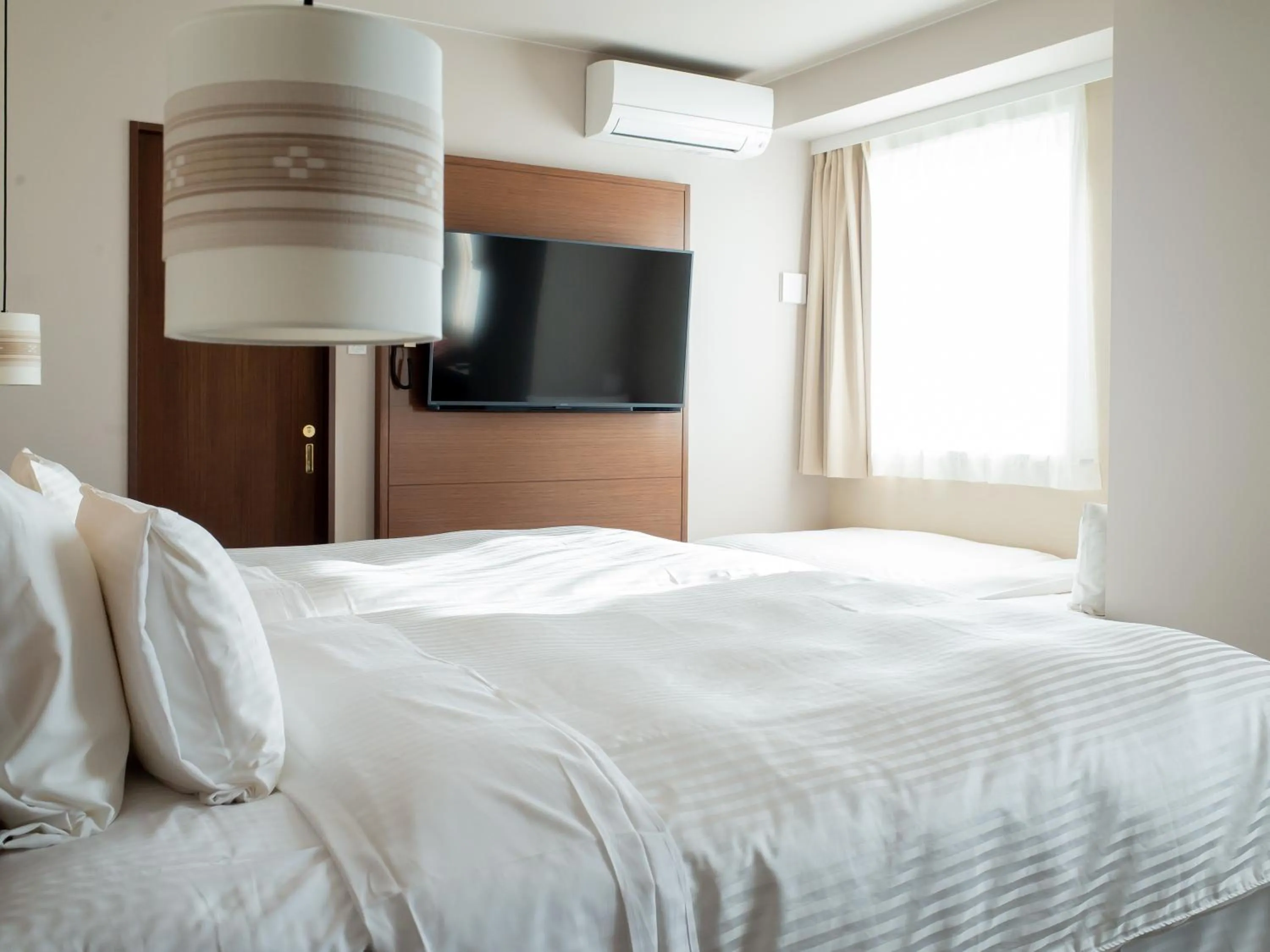 Bed in Hotel Palm Royal Resort Kokusai Street