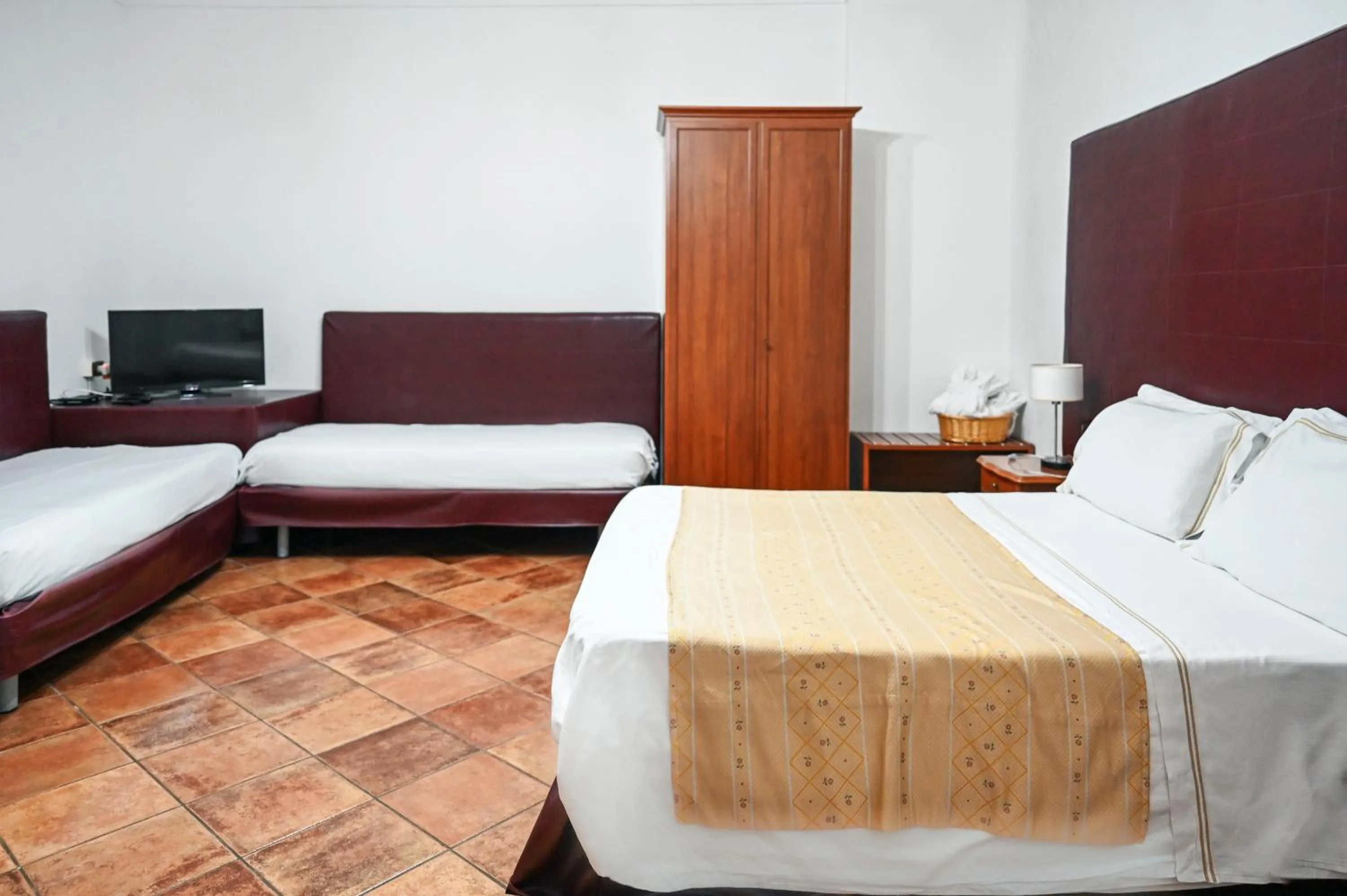Bed in Hotel Palazzo Krataiis