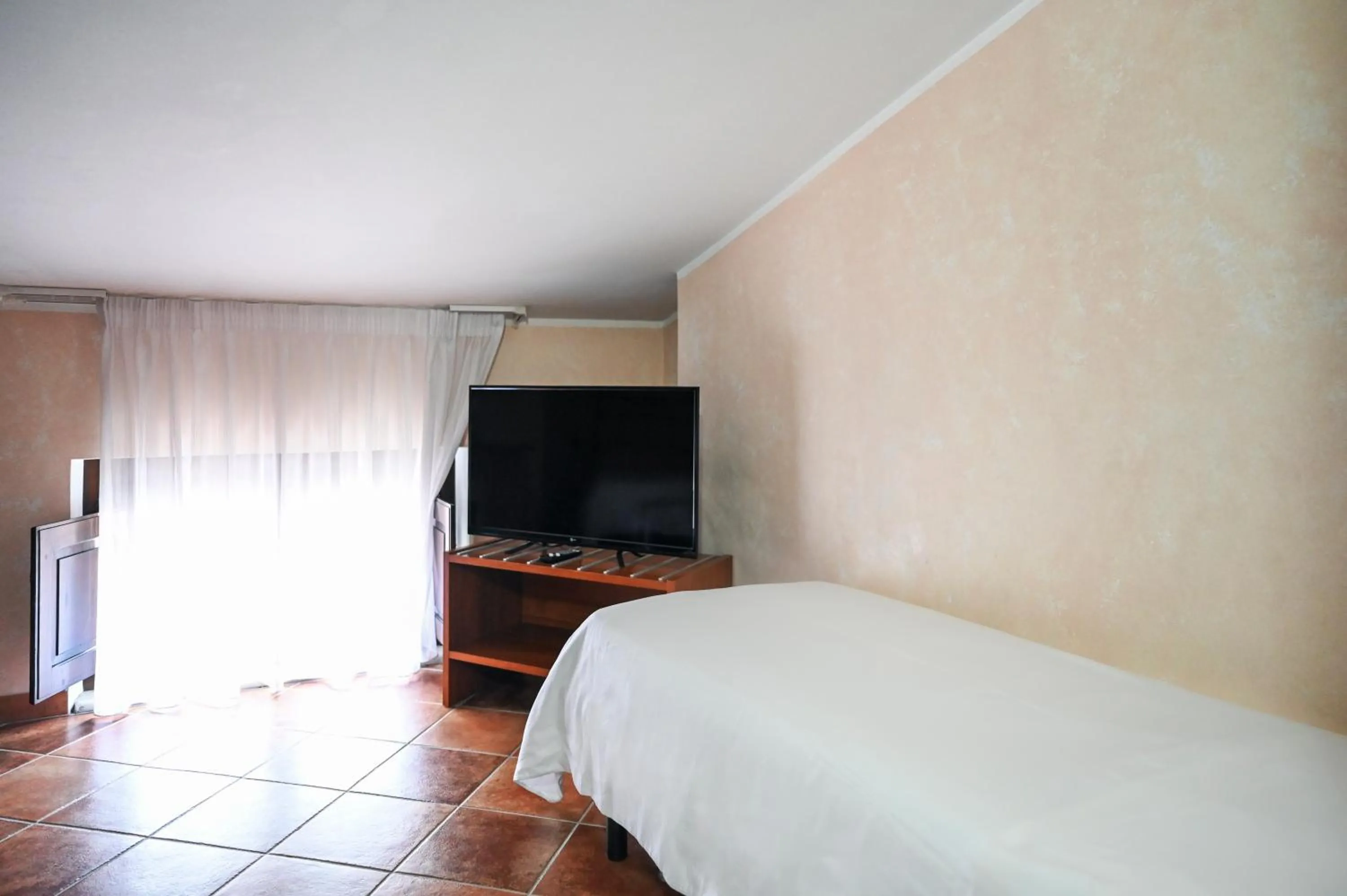 Bed in Hotel Palazzo Krataiis