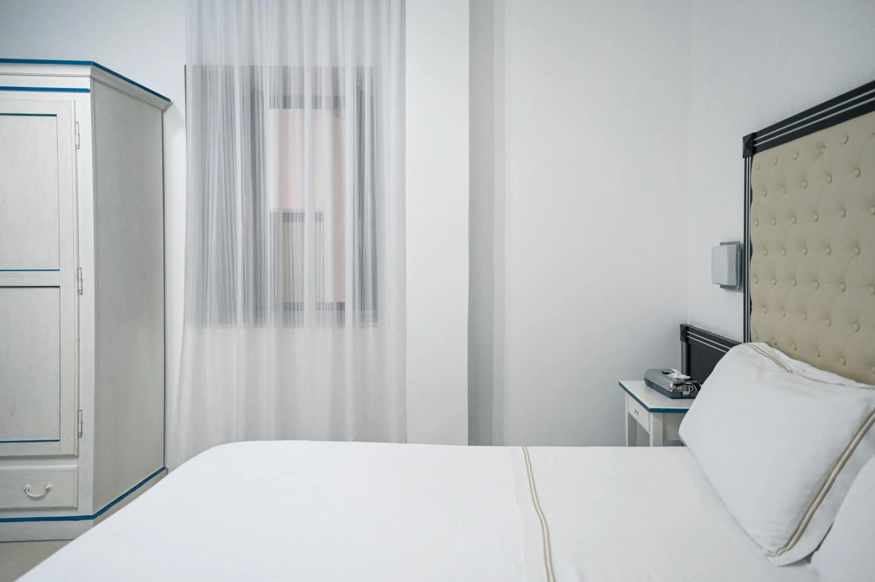 Bed in Hotel Palazzo Krataiis