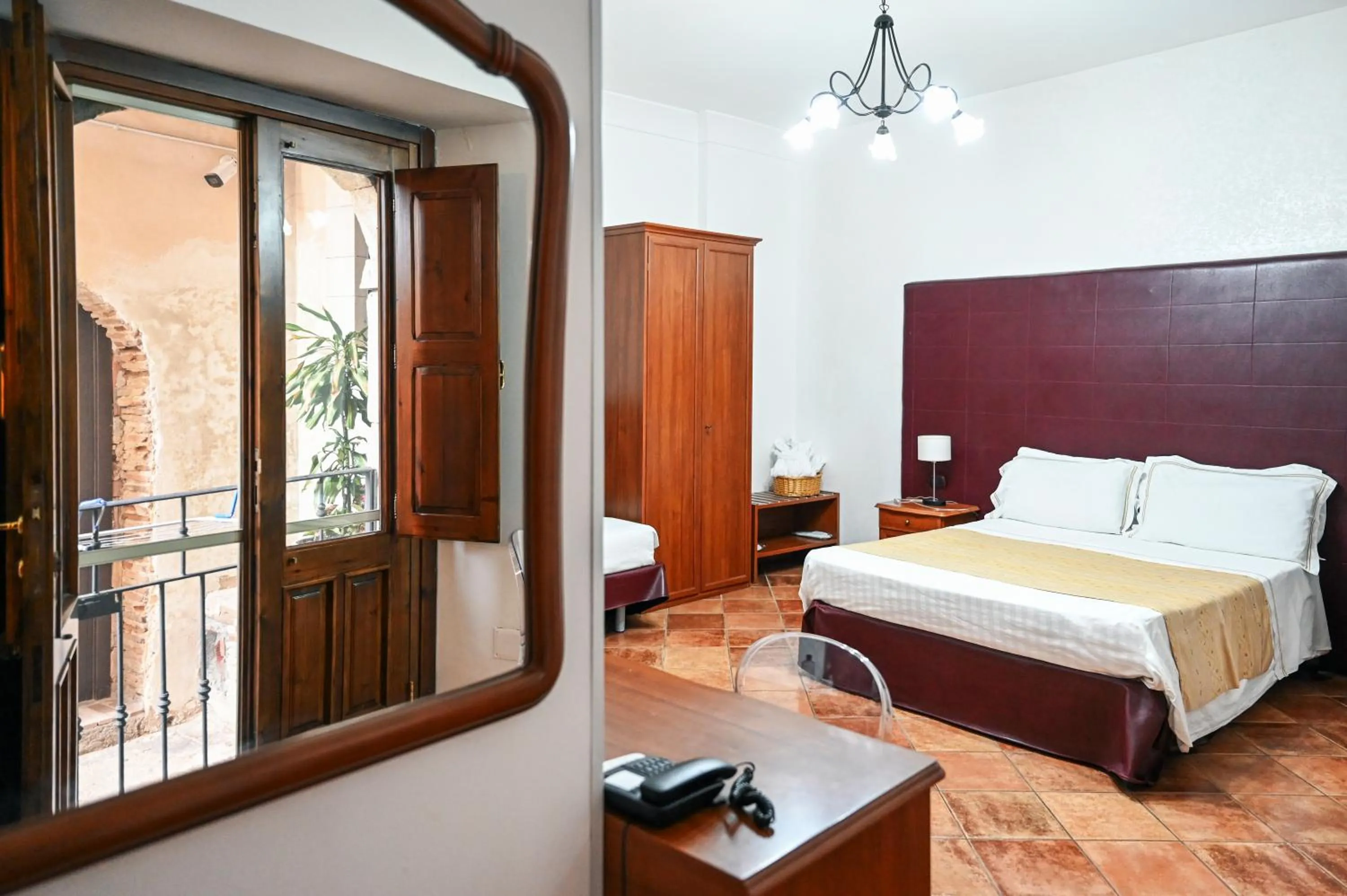 Bed in Hotel Palazzo Krataiis